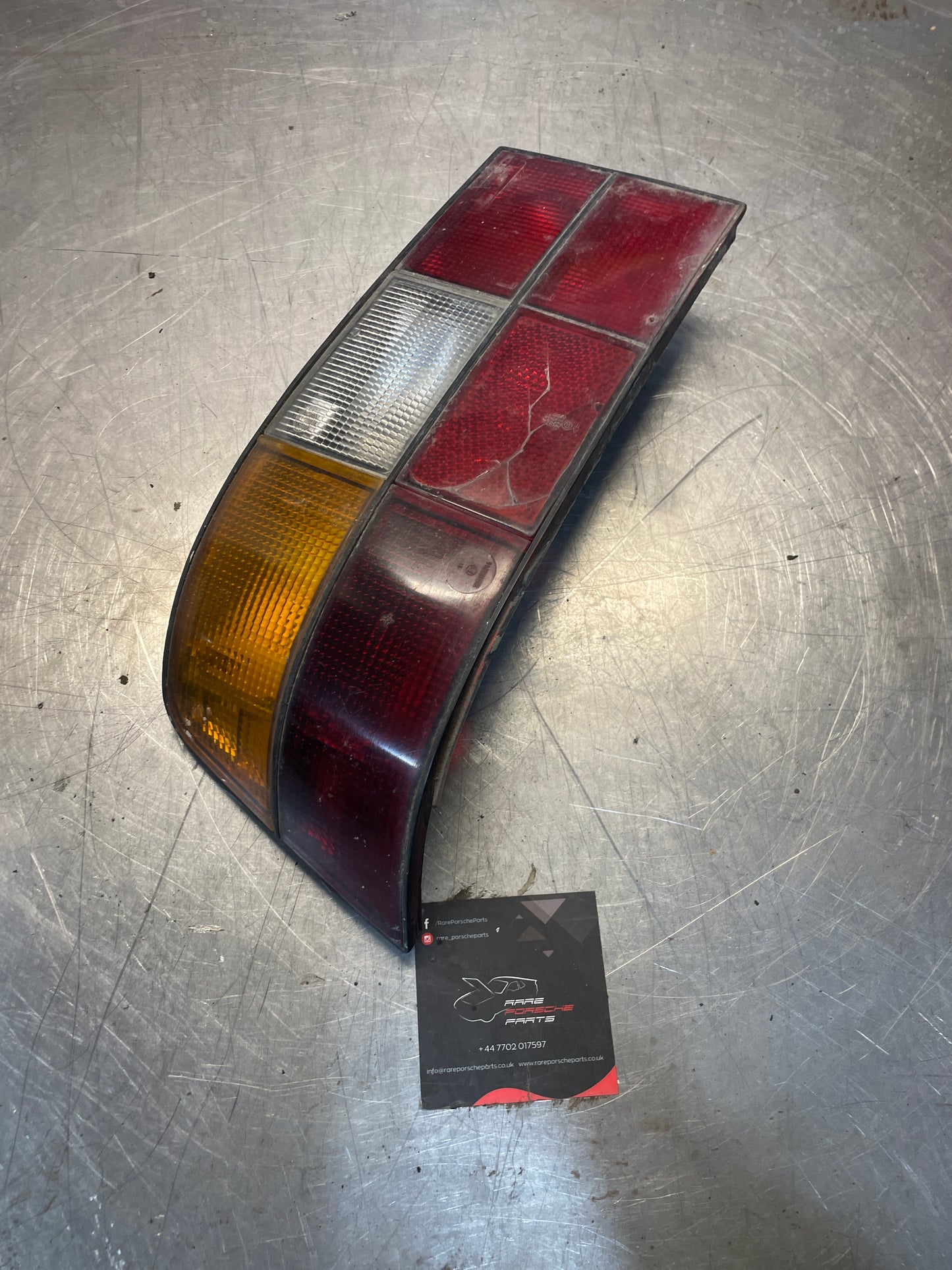 Porsche 924 / 944 left tail light, used, cracked