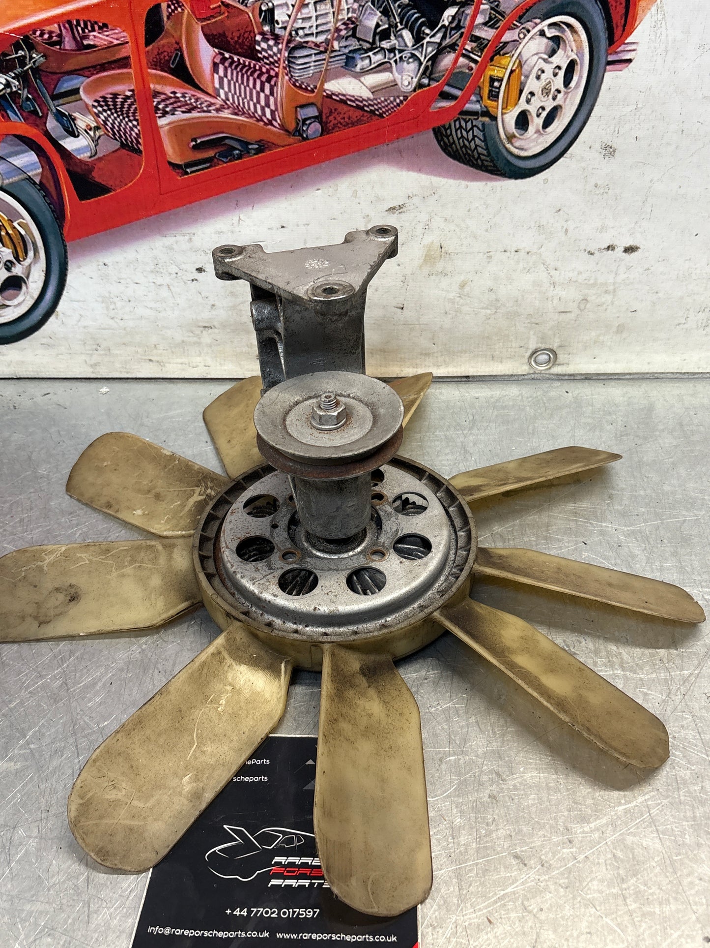 Porsche 928 late engine cooling fan clutch with bracket, used 92810611205 / 92810613701 / 9281061104R