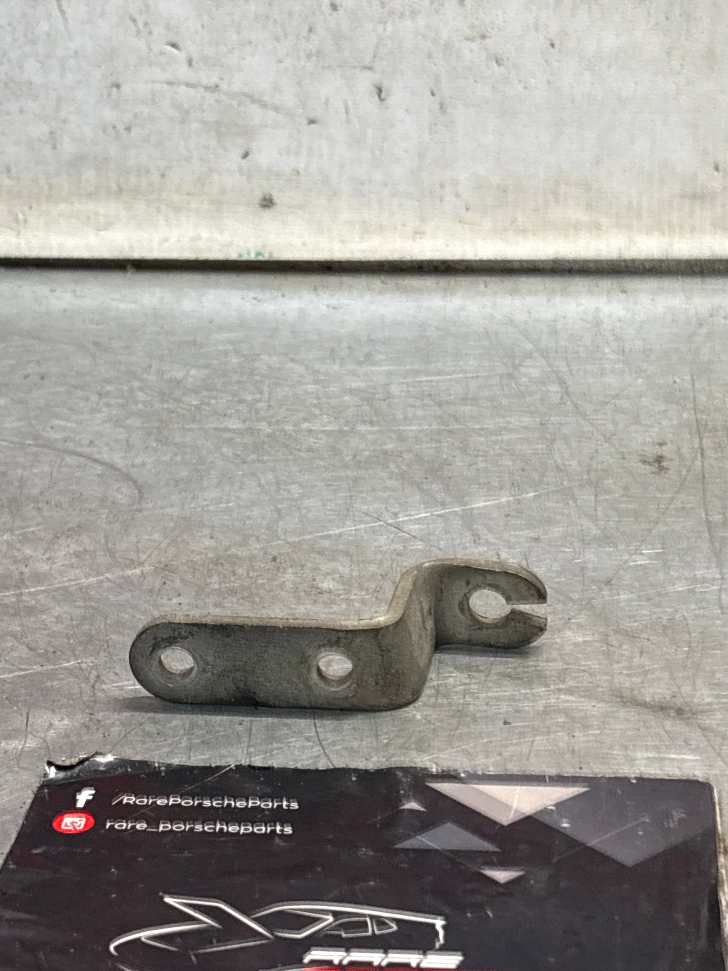 Porsche 924 LHD exhaust manifold bracket, used 047133239