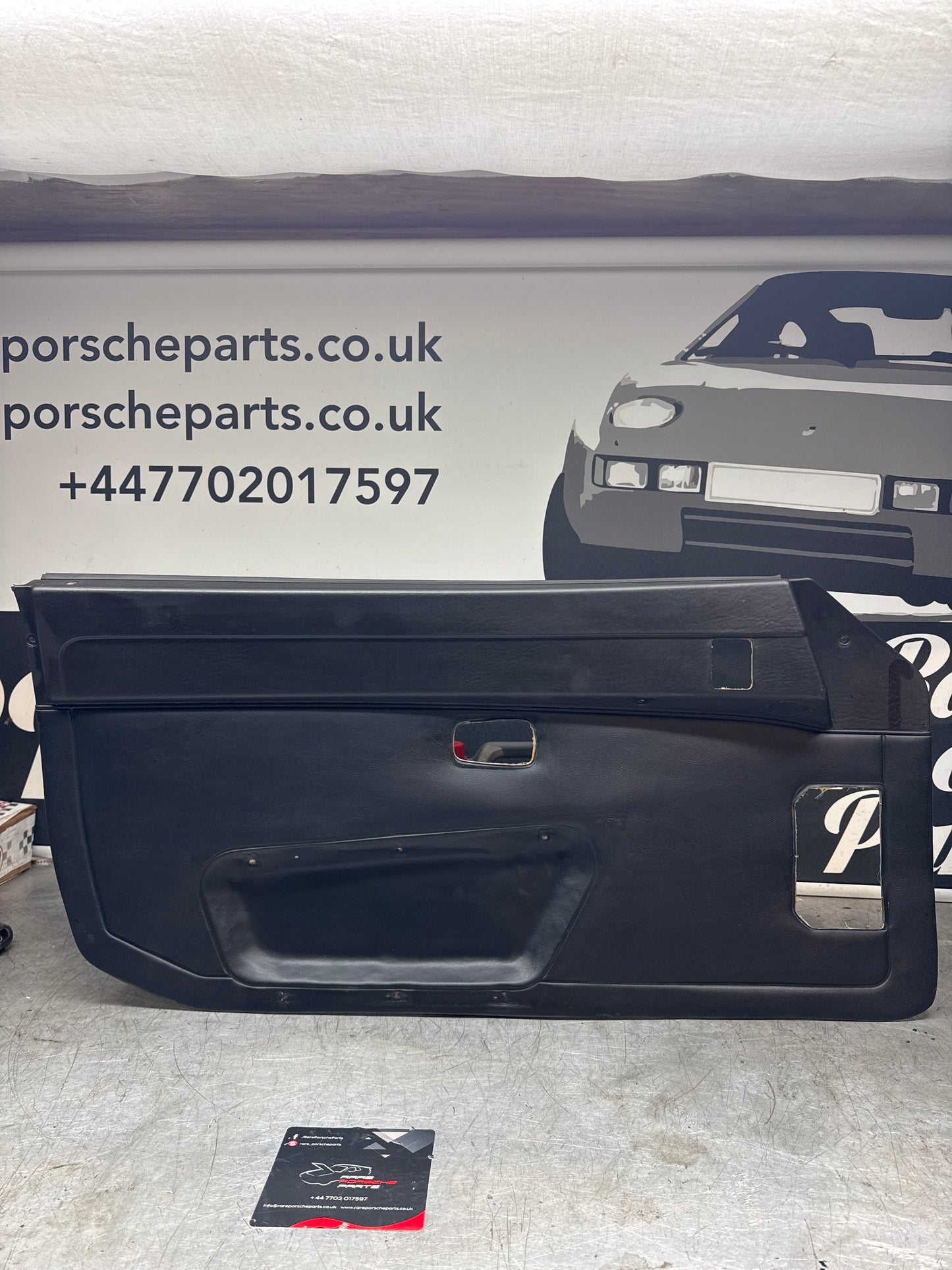 Porsche 924/ Early 944 black RHD Left door card. Fibreglass repaired. 477867012