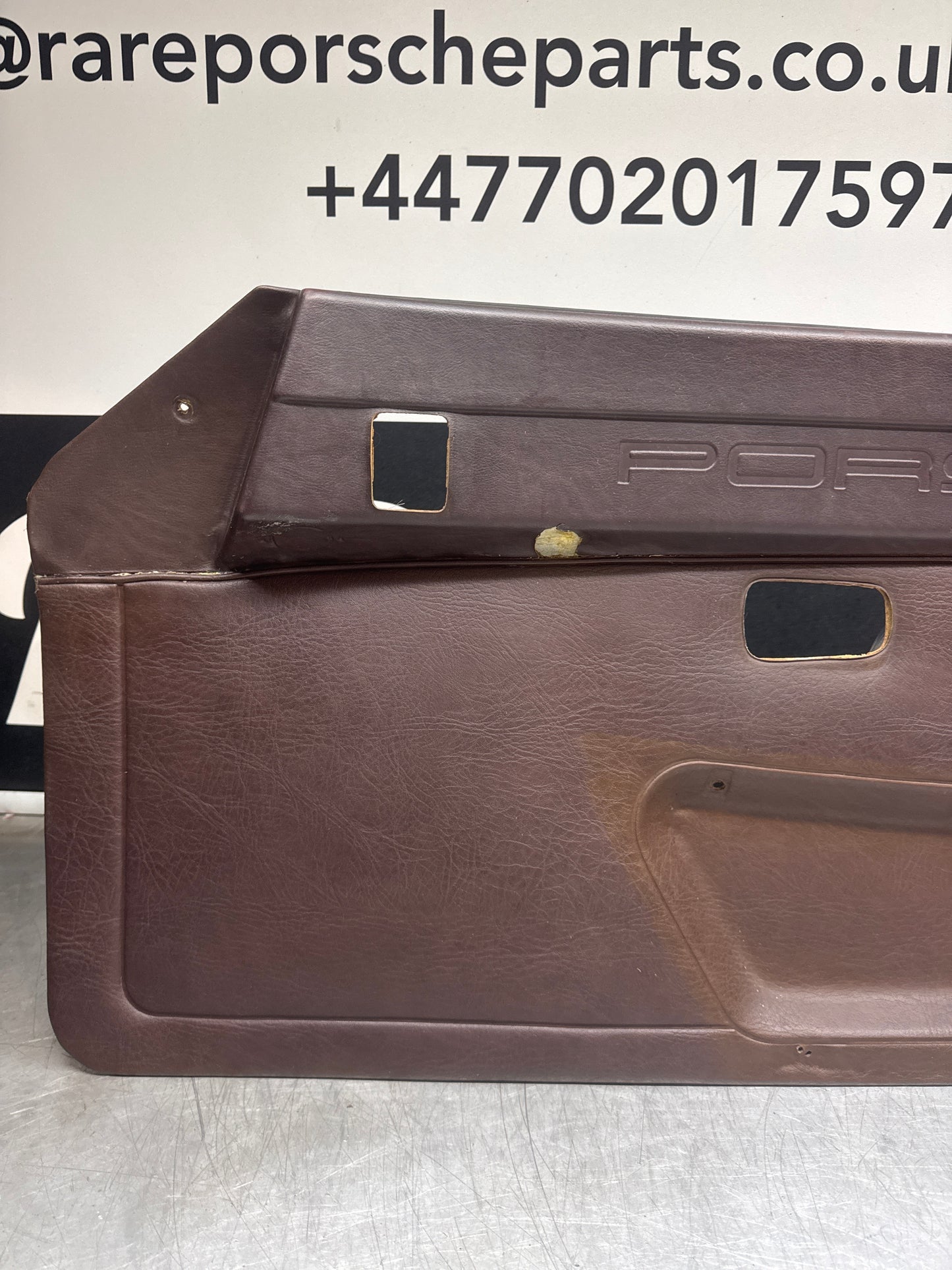 Porsche 924 / Early 944 Brown Script Door card. Left Hand Drive. Used. 478867011. Fibreglass repaired.