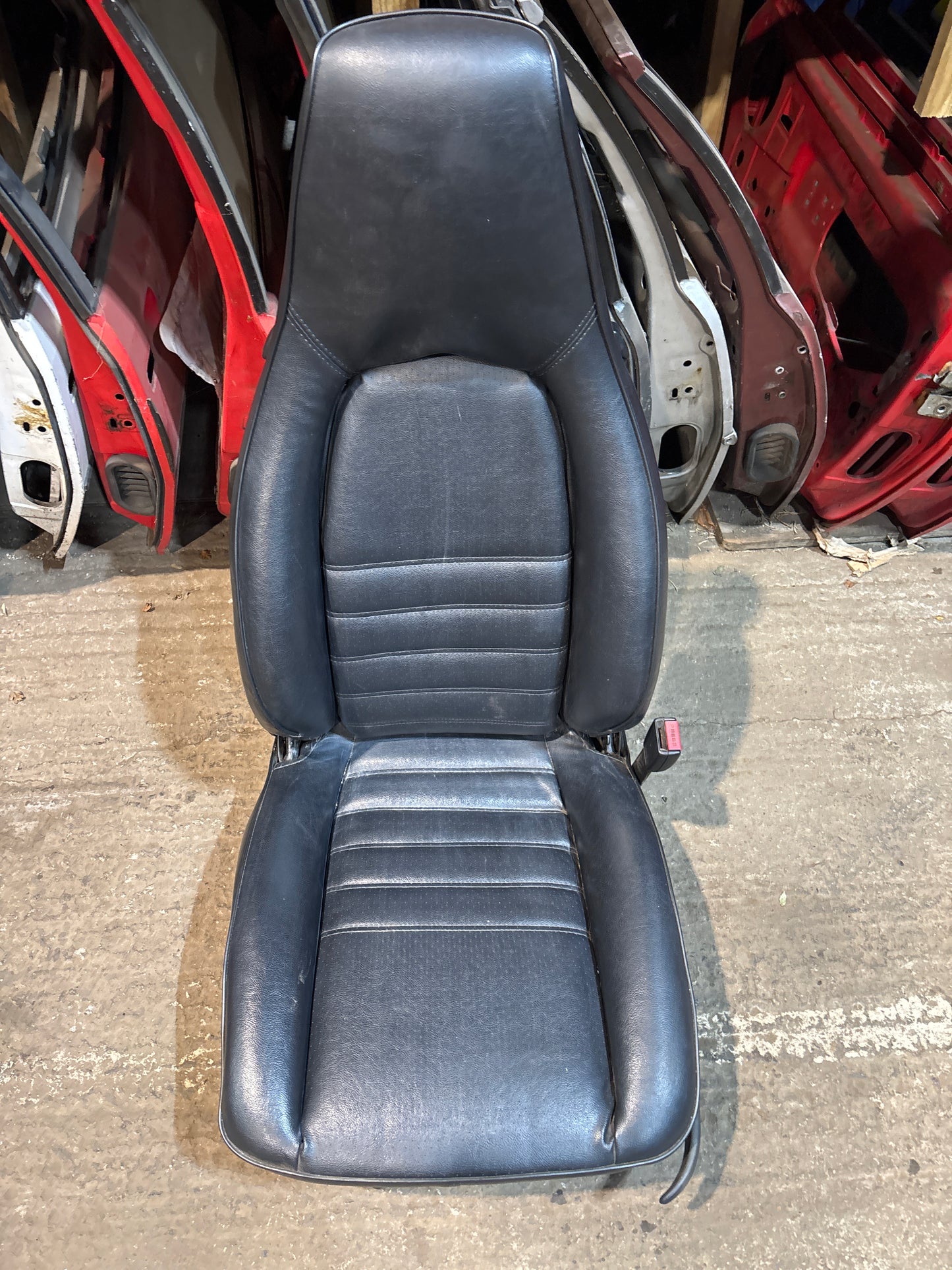 Porsche 944 black front right seat with Porsche scripted fabric