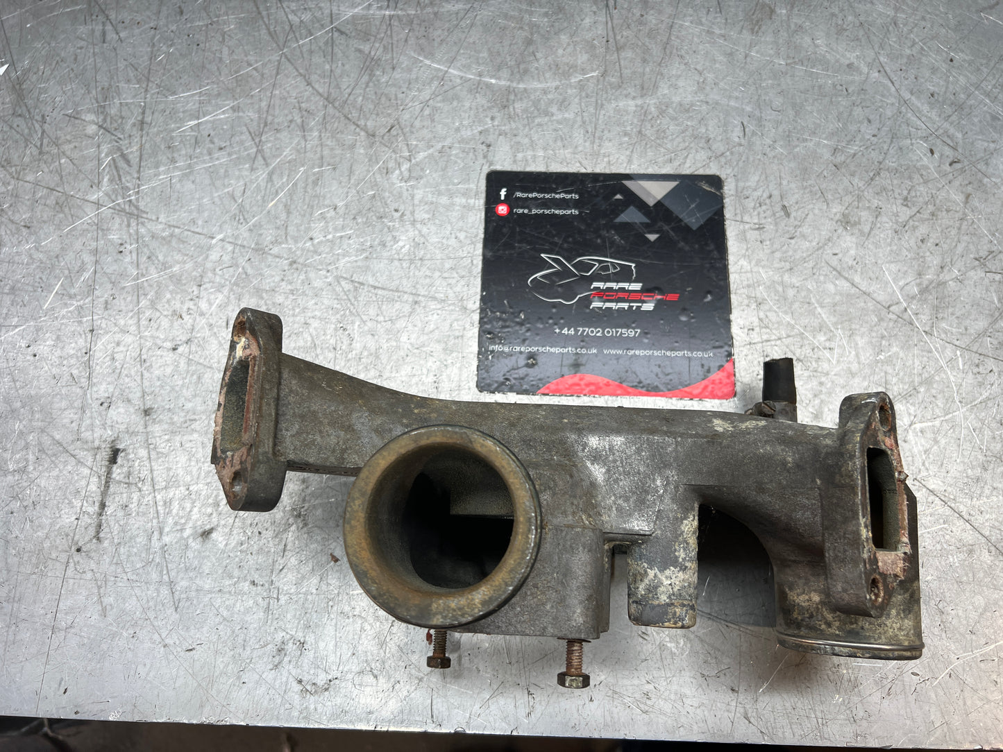 Porsche 928 thermostat housing, used 9281061614R