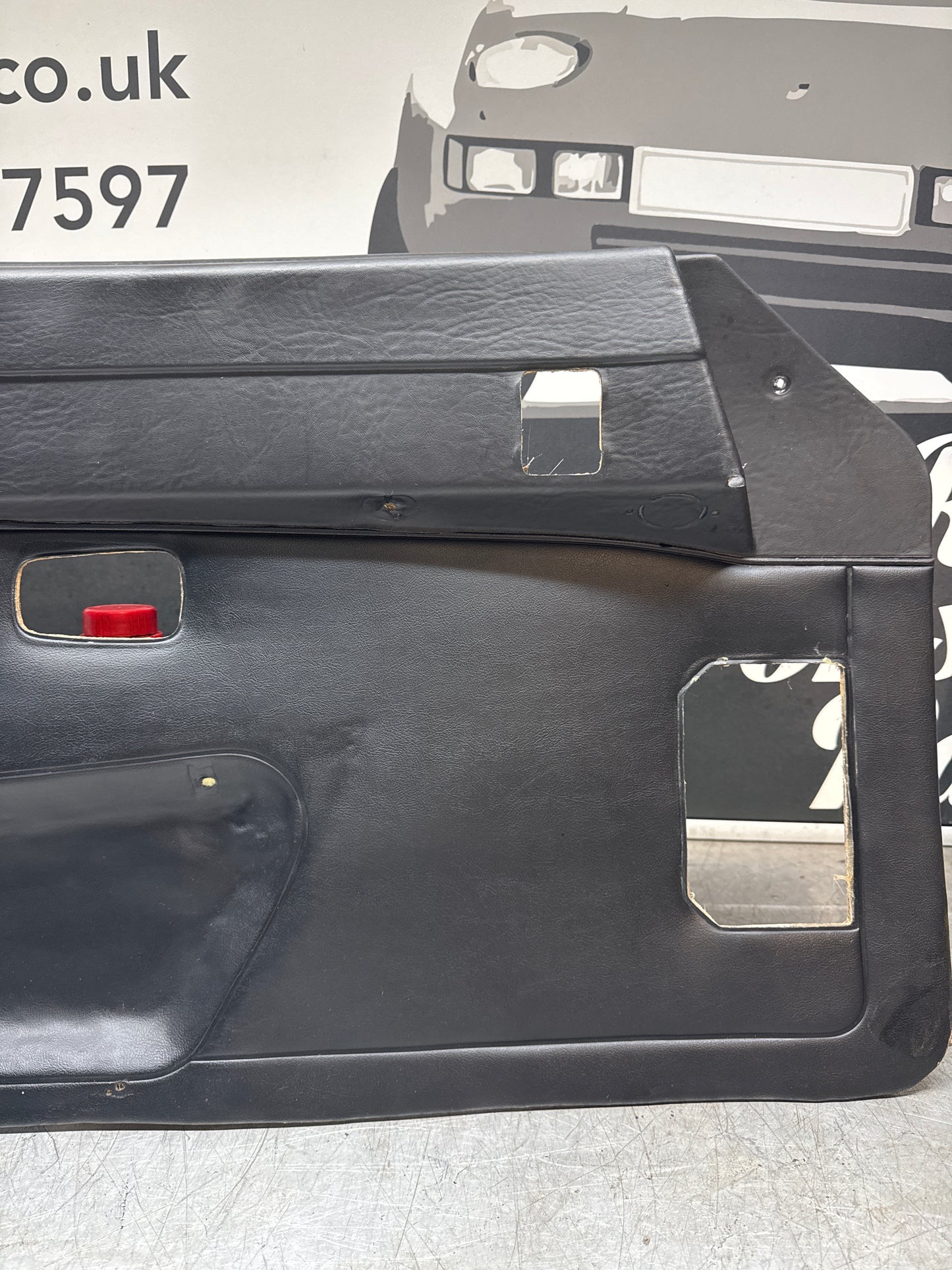 Porsche 924/ Early 944 black RHD Left door card. Fibreglass repaired. 477867012