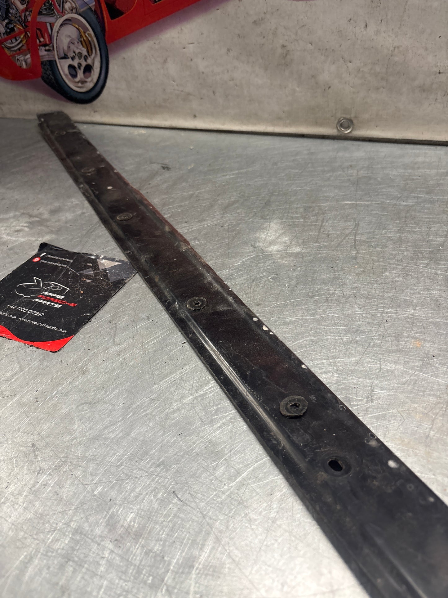 Porsche 928 water drain plate, used 92856416741