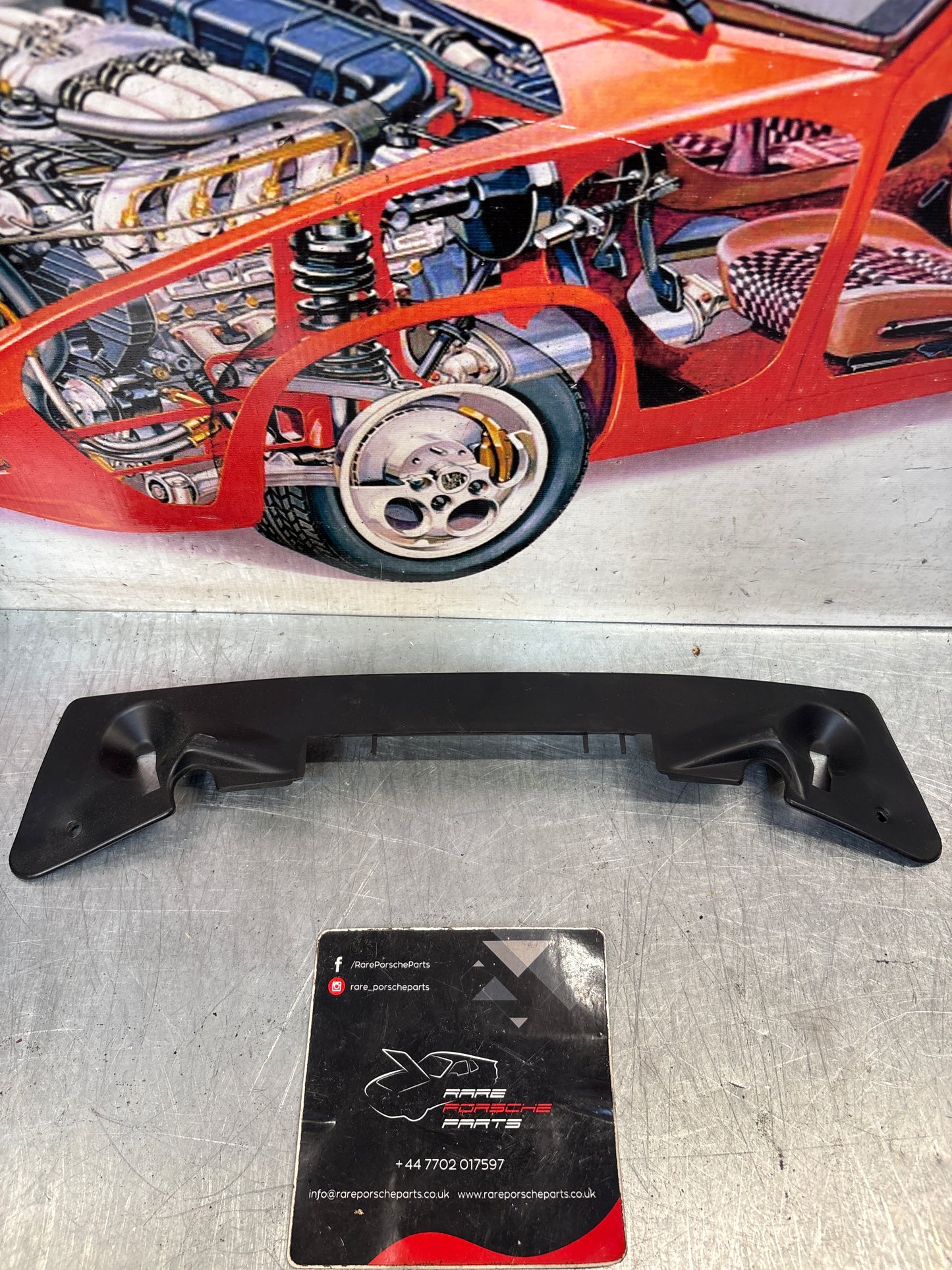 Porsche 928 instrument cluster lower trim, used 92855232102