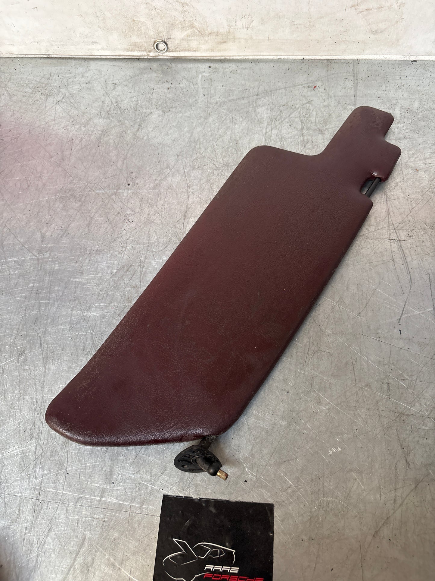 Porsche 944 left N/S sun visor in burgundy, used for late cars 94473103101