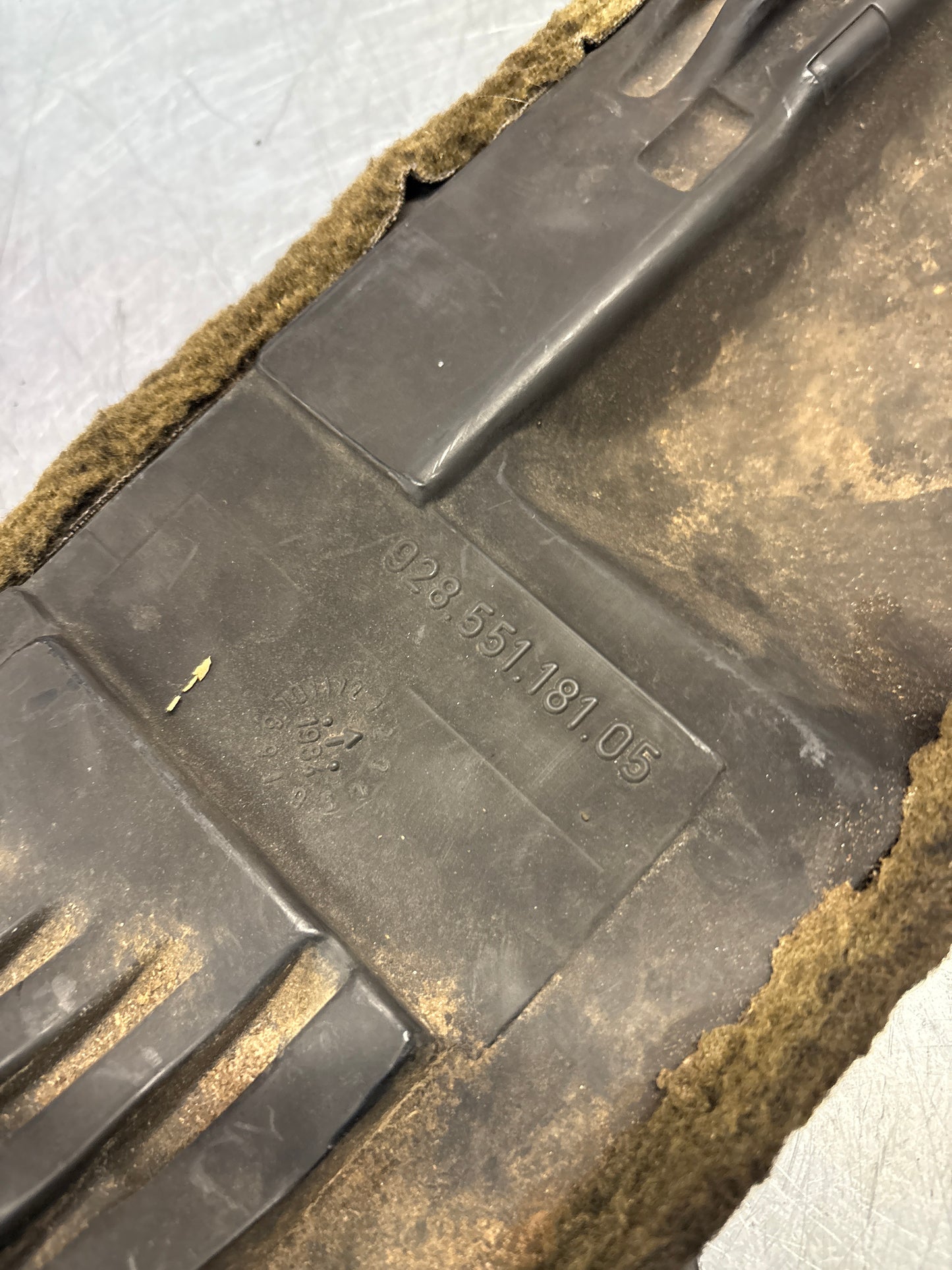 Porsche 928 black carpeted Tool kit panel cover, used 92855118105