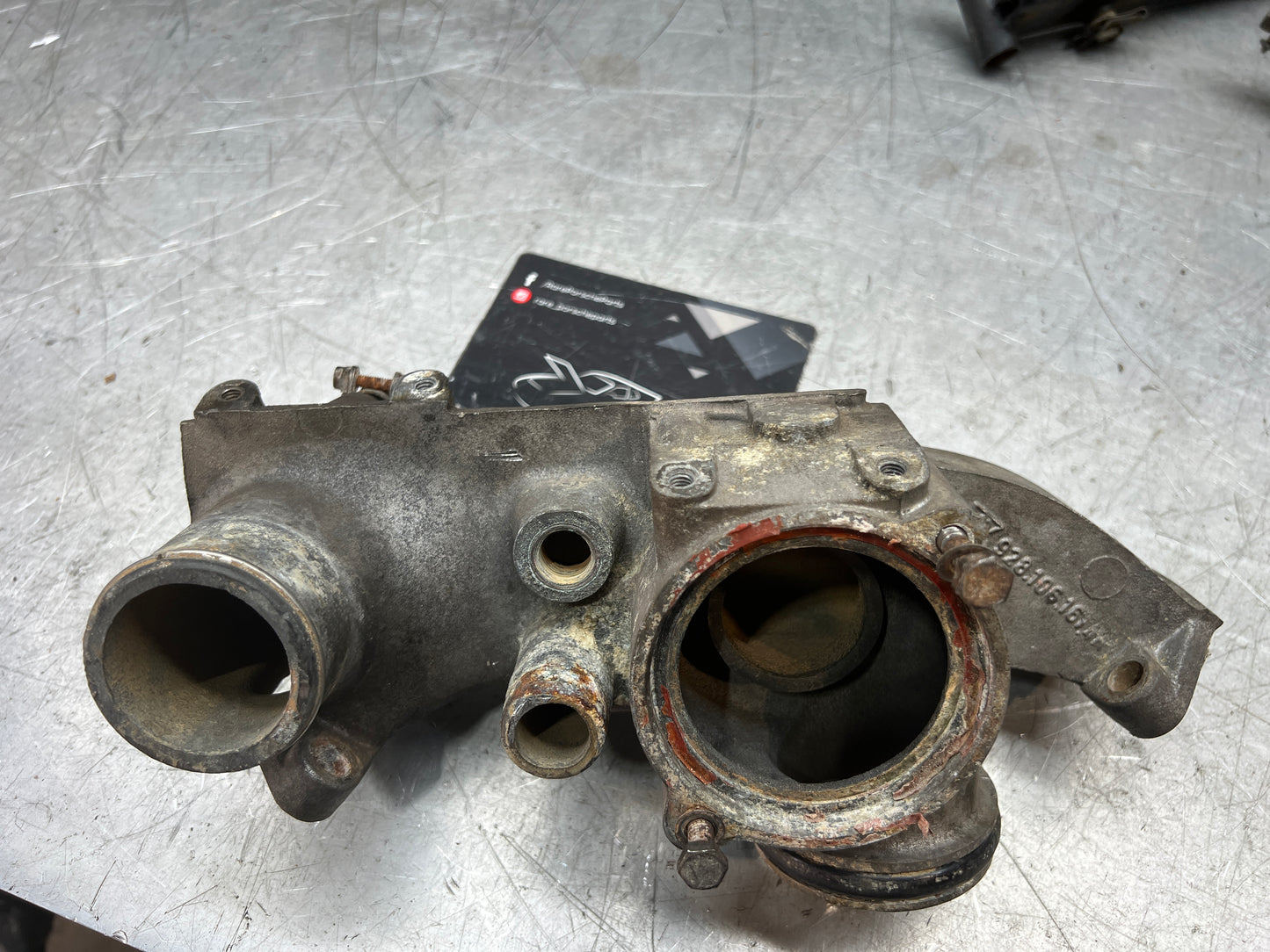 Porsche 928 thermostat housing, used 9281061614R