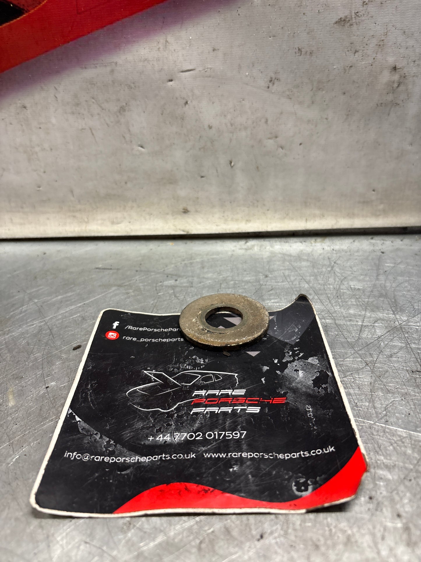 Porsche 928 wishbone bearing pin plate, used 92833164702