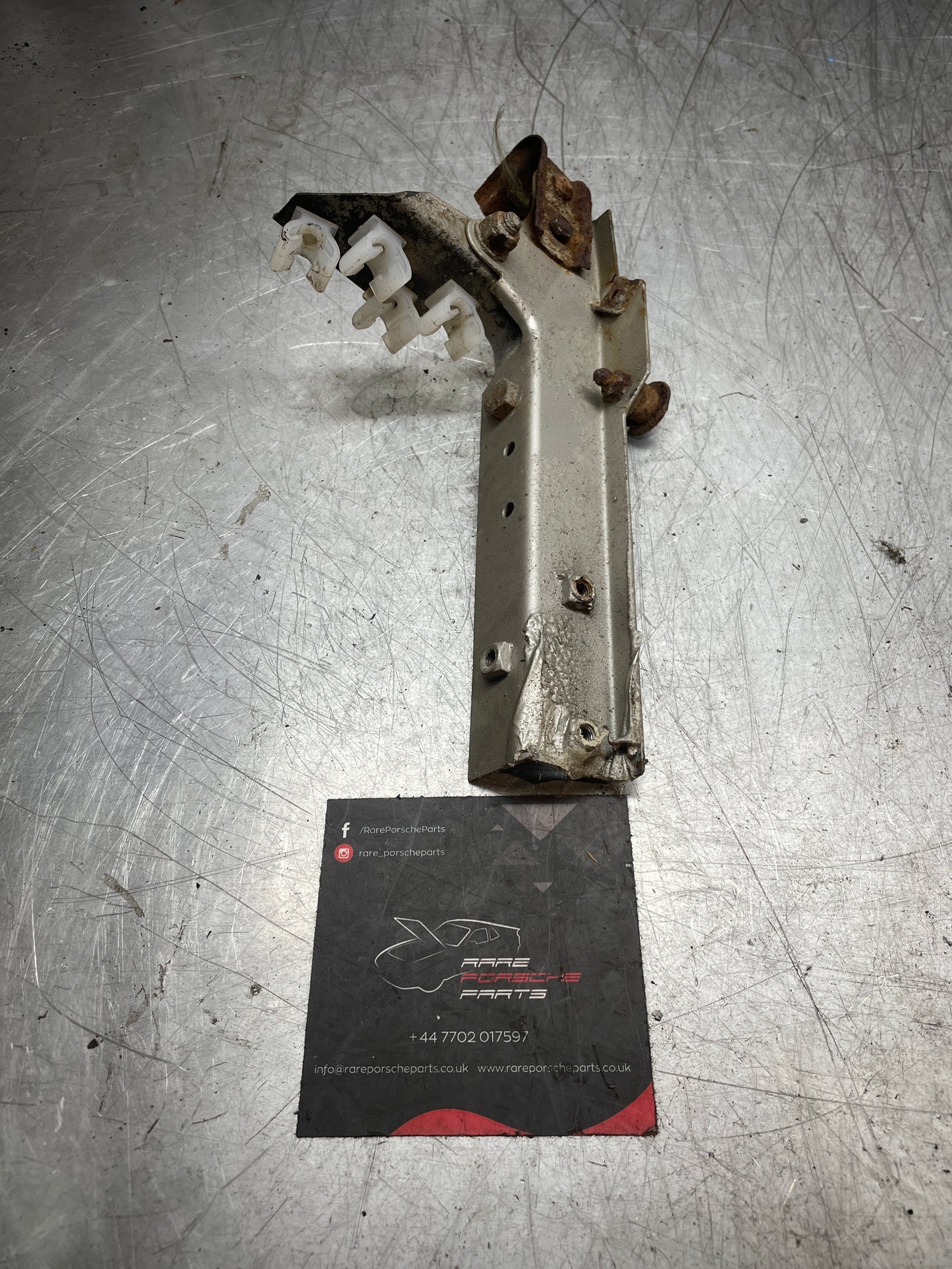 Porsche 924 944 Used wing to Body Reinforcement bracket, with powersteering cooler bracket, left 477805058A used