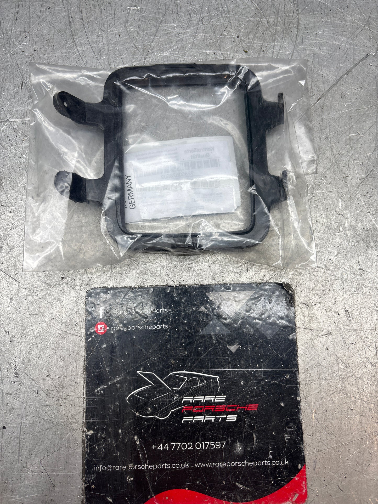 Porsche 928 rear fog light frame, left, new 92850528502