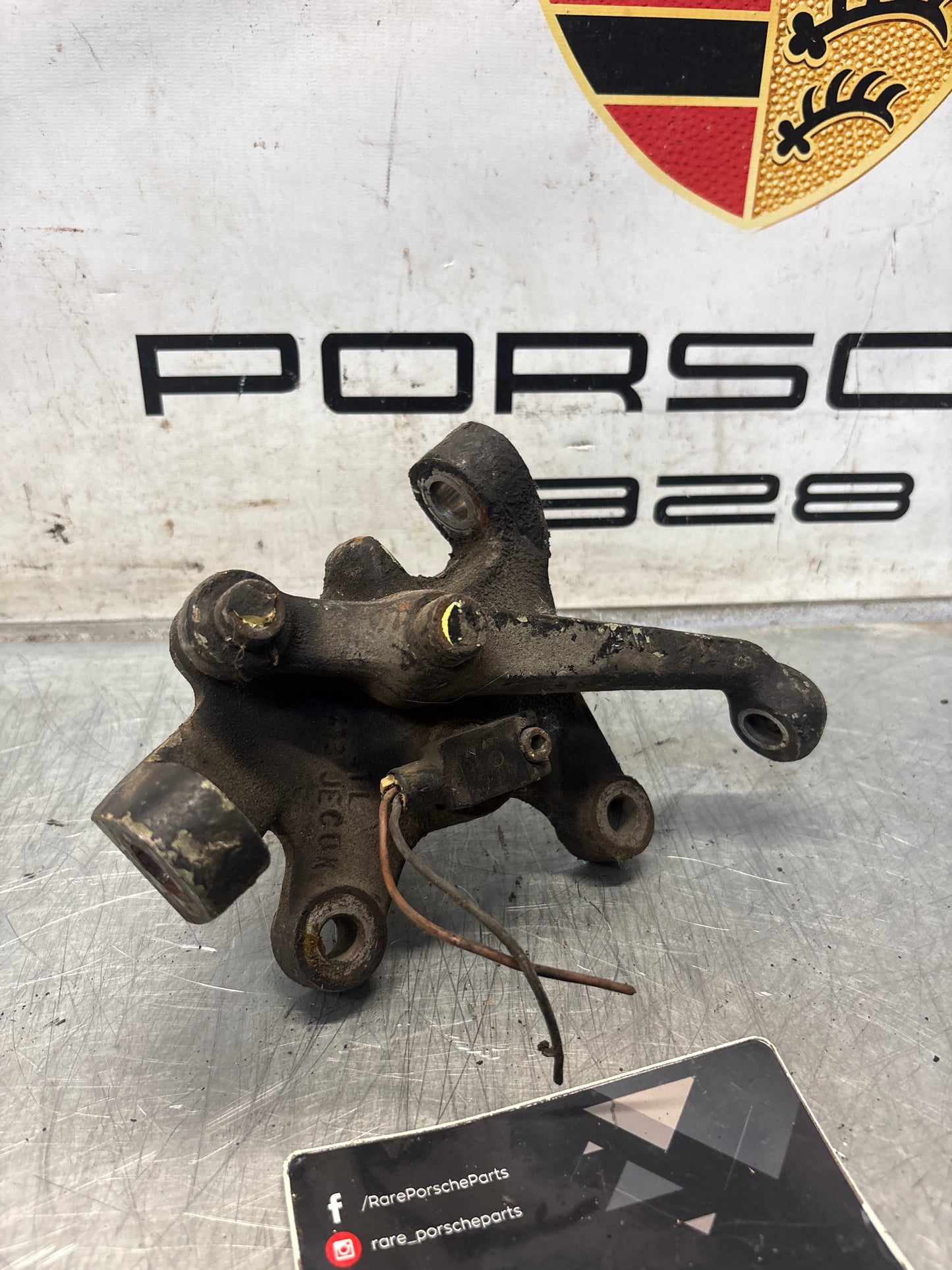 Porsche 928 left steering spindle knuckle, used 92834105717