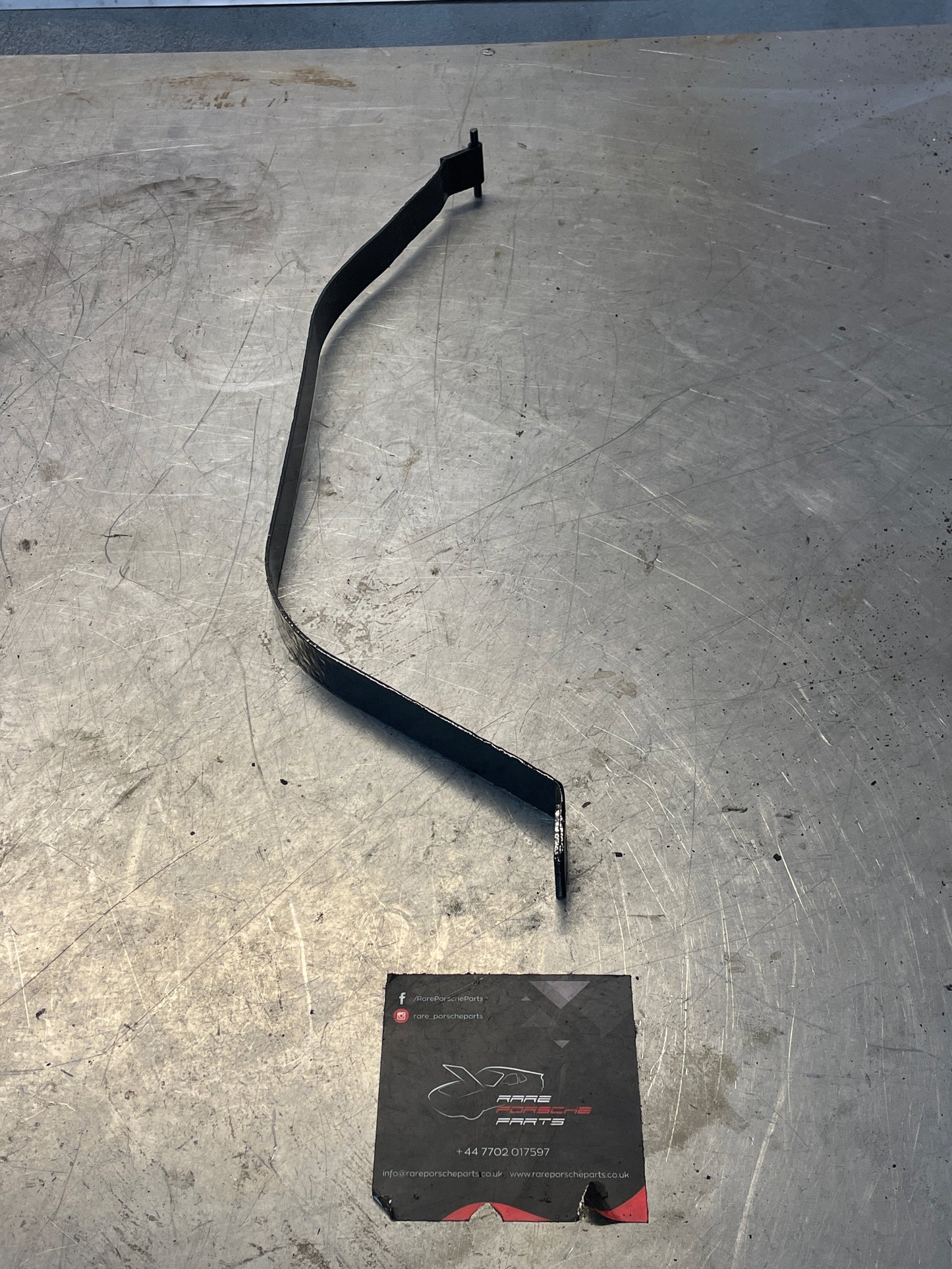 Porsche 924 / 944 76-79 fuel tank strap, left, refurbished 477201395