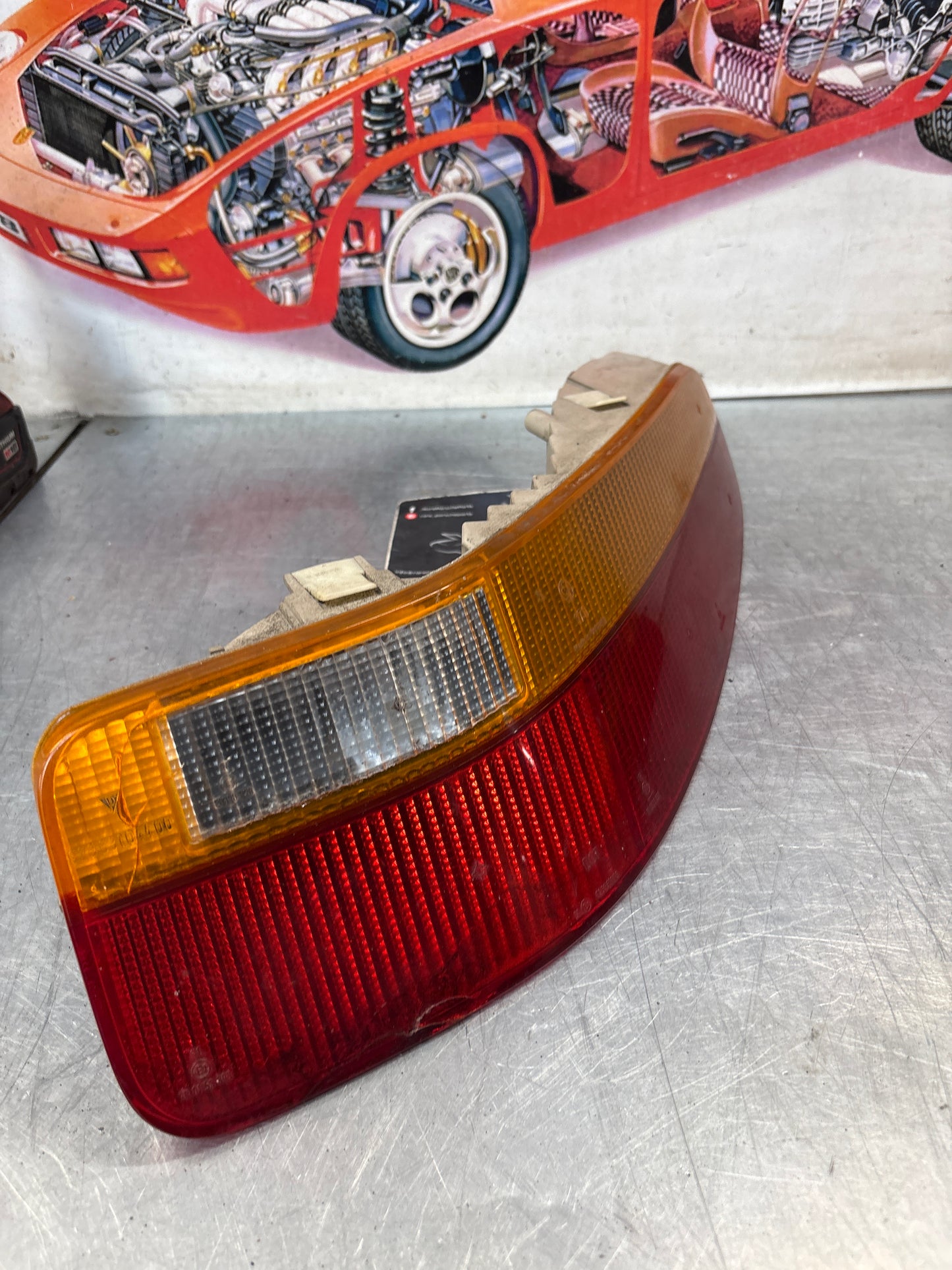 Porsche 928 rear right tail light, used, cracked 92863104400