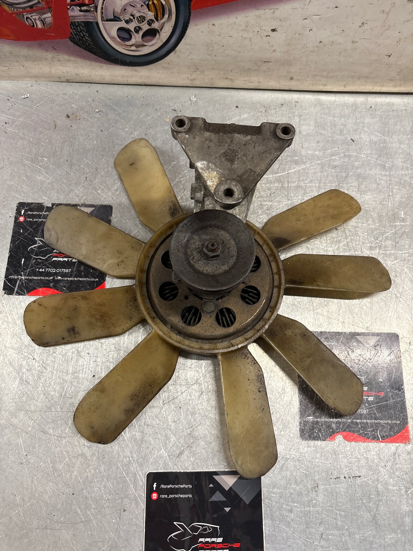 Porsche 928 late engine cooling fan clutch with bracket, used 92810611205 / 92810613701 / 9281061104R