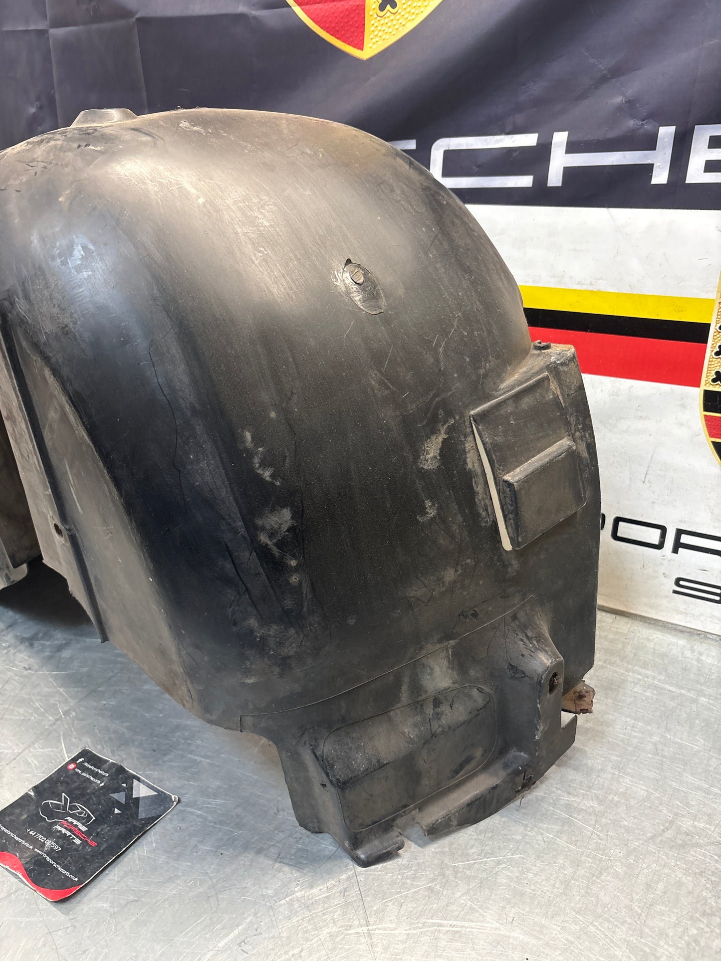 Porsche 944 from 85.5 wheel arch liner  Left, 94450438101 Used
