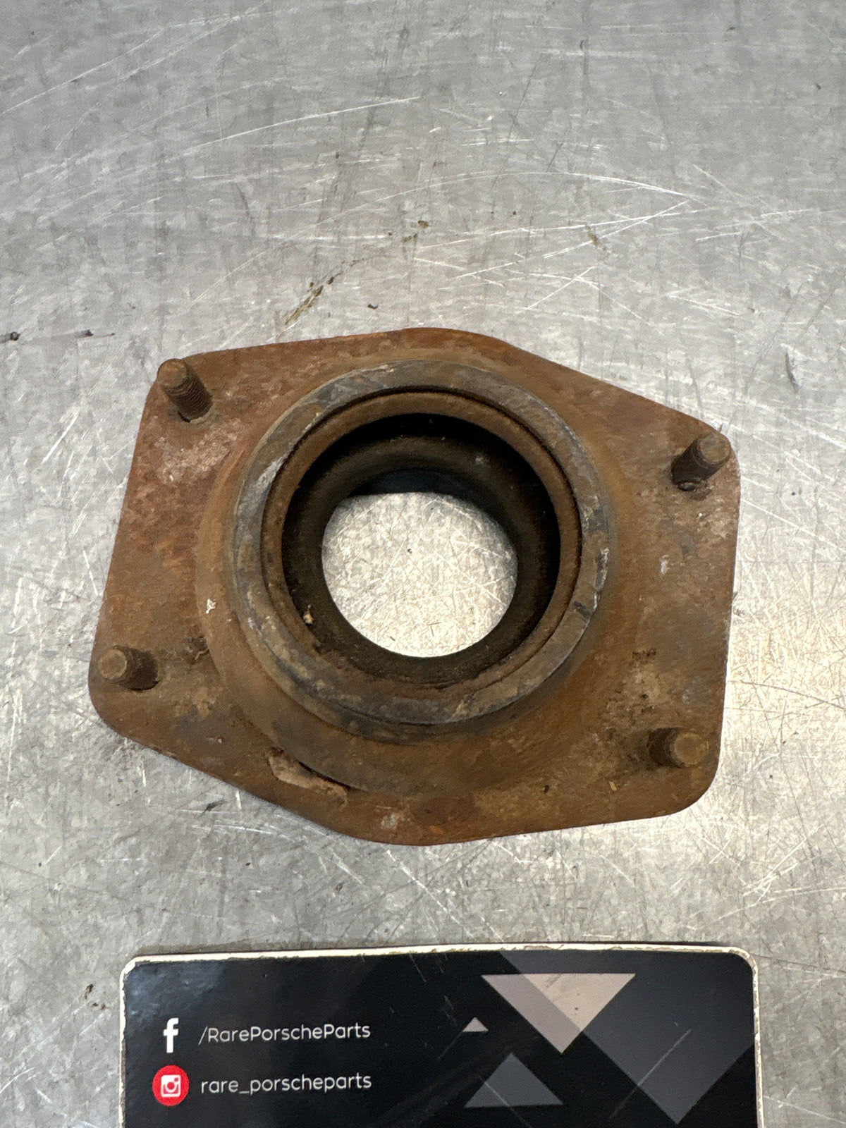 Porsche 924 / 944 front suspension bearing flange, 477412345, used