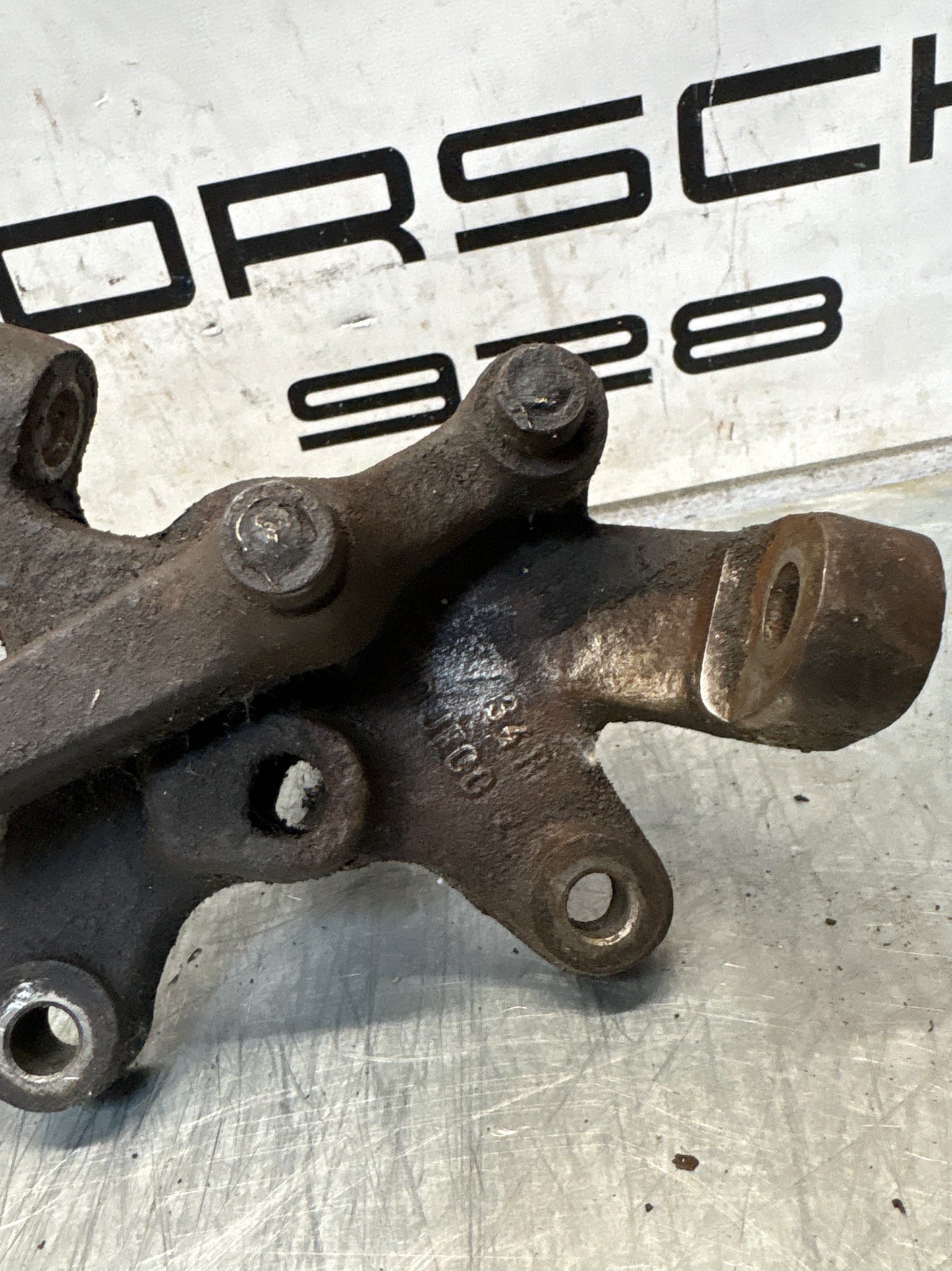 Porsche 928 right steering spindle knuckle, used 92834105803