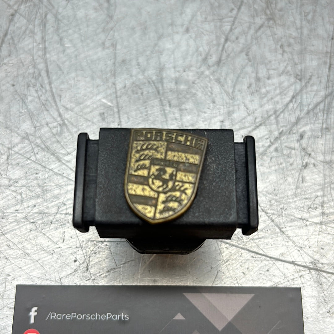 Porsche 924/944 black glove box lock with badge 477857133 used
