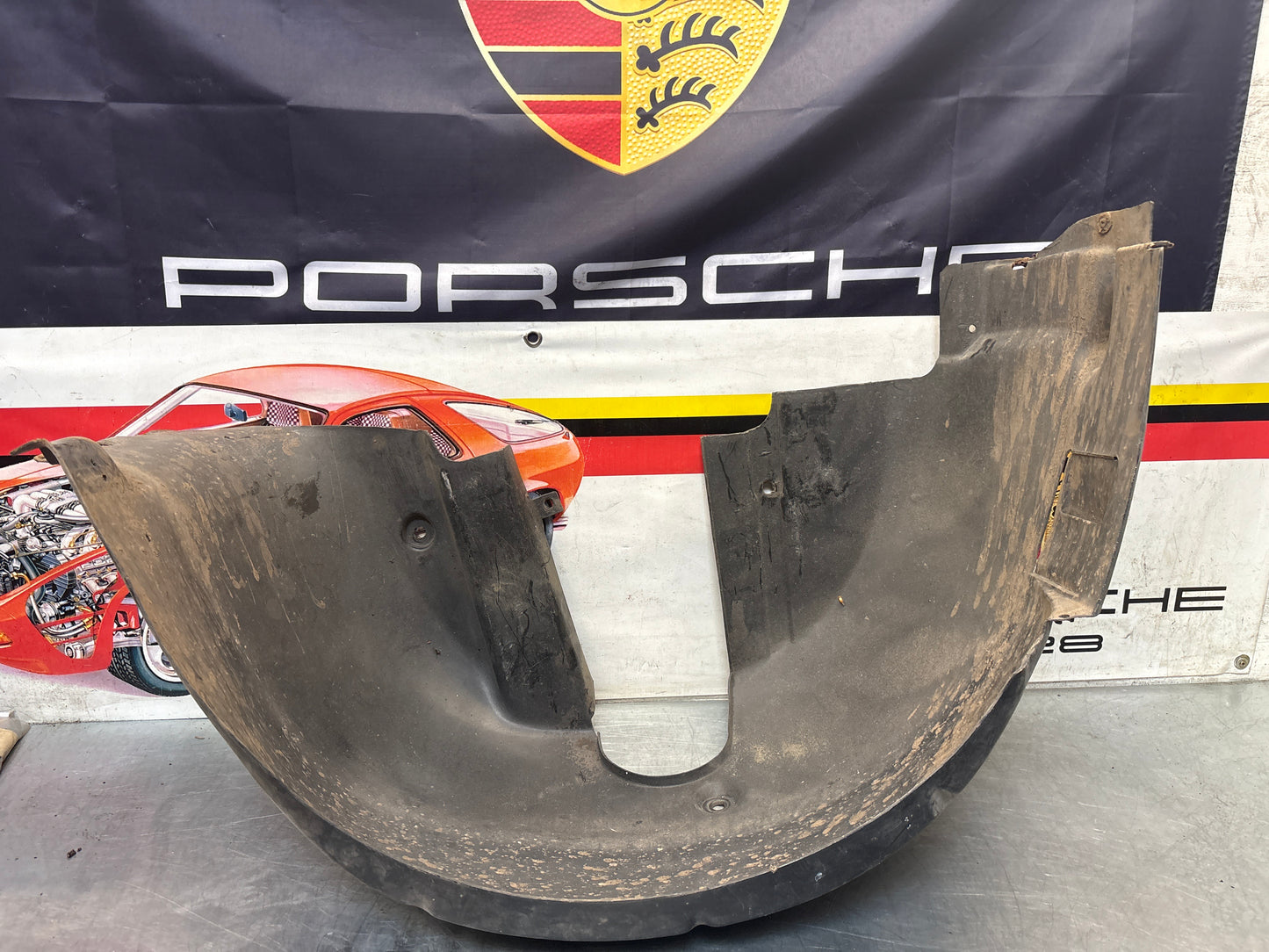 Porsche 944 from 85.5 wheel arch liner  Left, 94450438101 Used