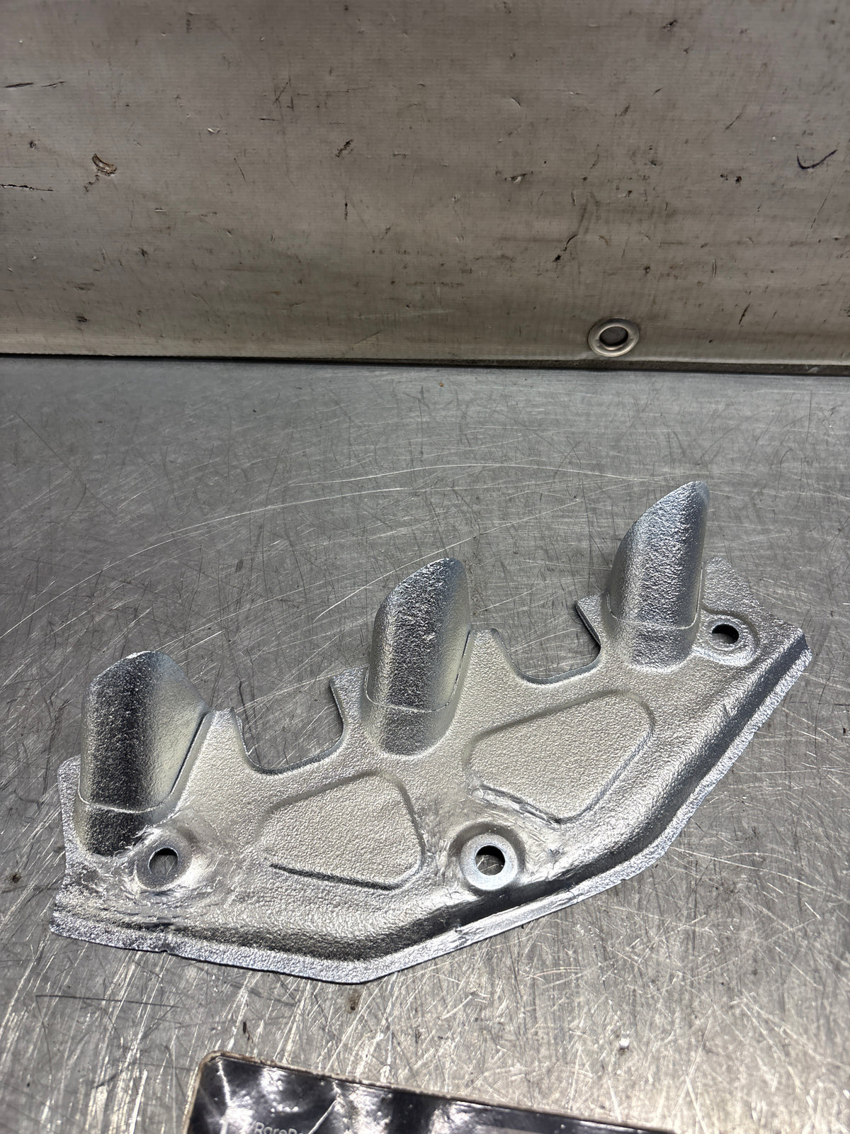 Porsche 924 exhaust heat shield / spark plug shield, refurbished 047129593