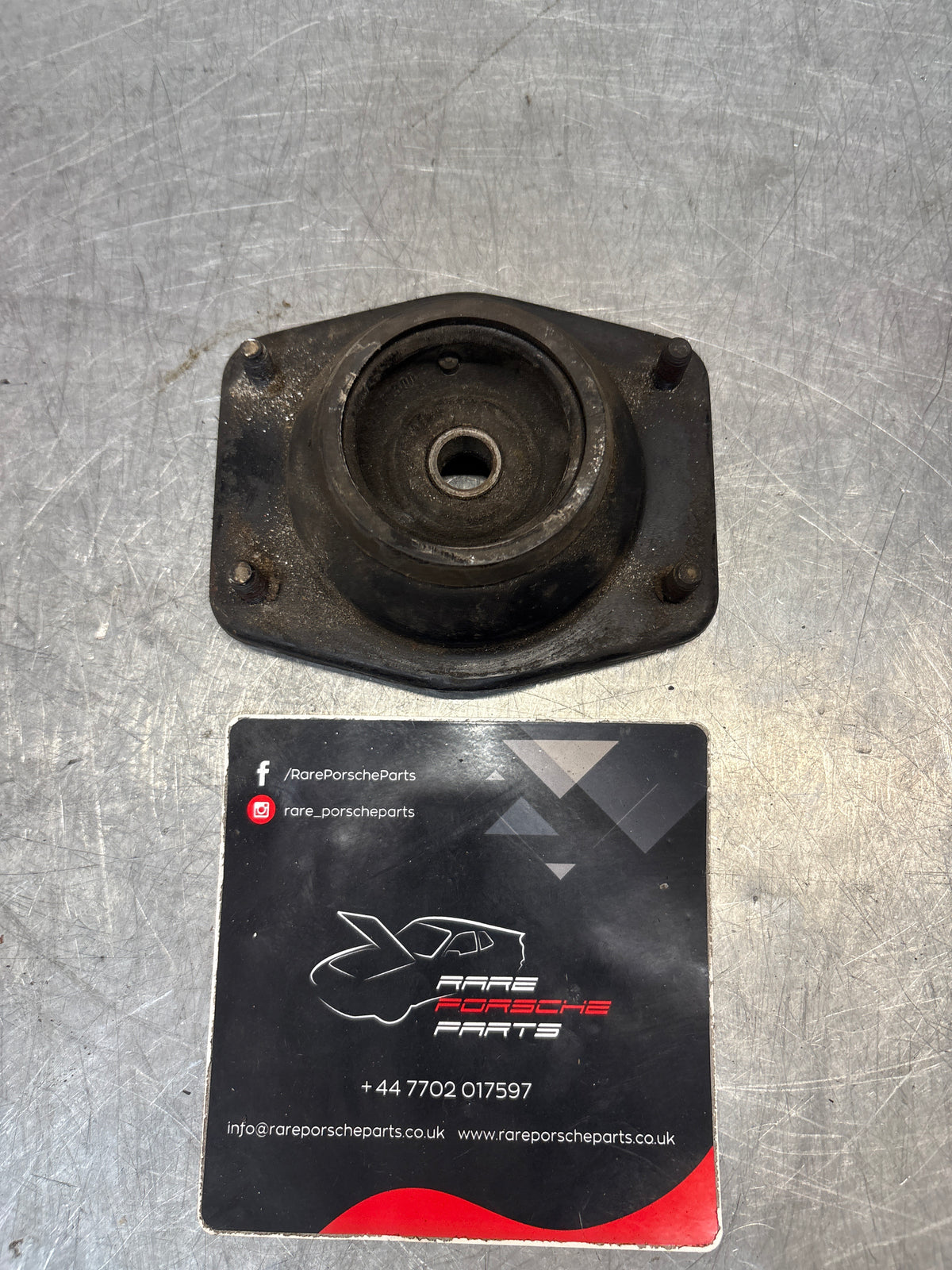 Porsche 924 / 944 front suspension bearing flange, 477412345, used