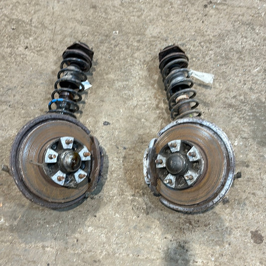 Porsche 944 early used pair of front suspension legs with brake calipers