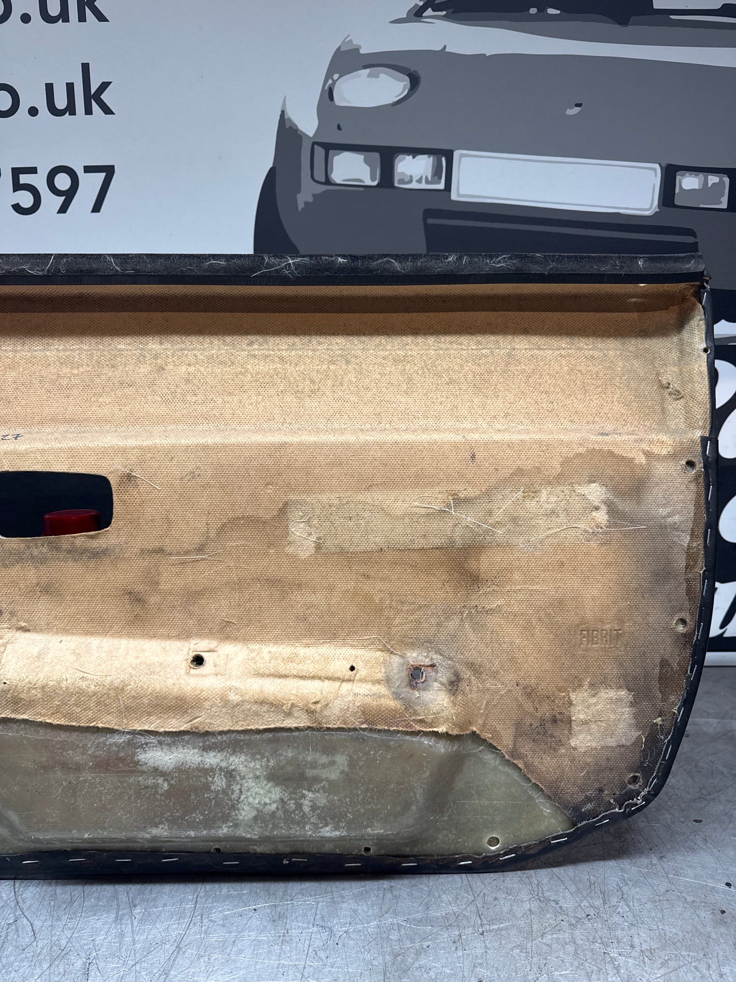 Porsche 924/ Early 944 black RHD Left door card. Fibreglass repaired. 477867012