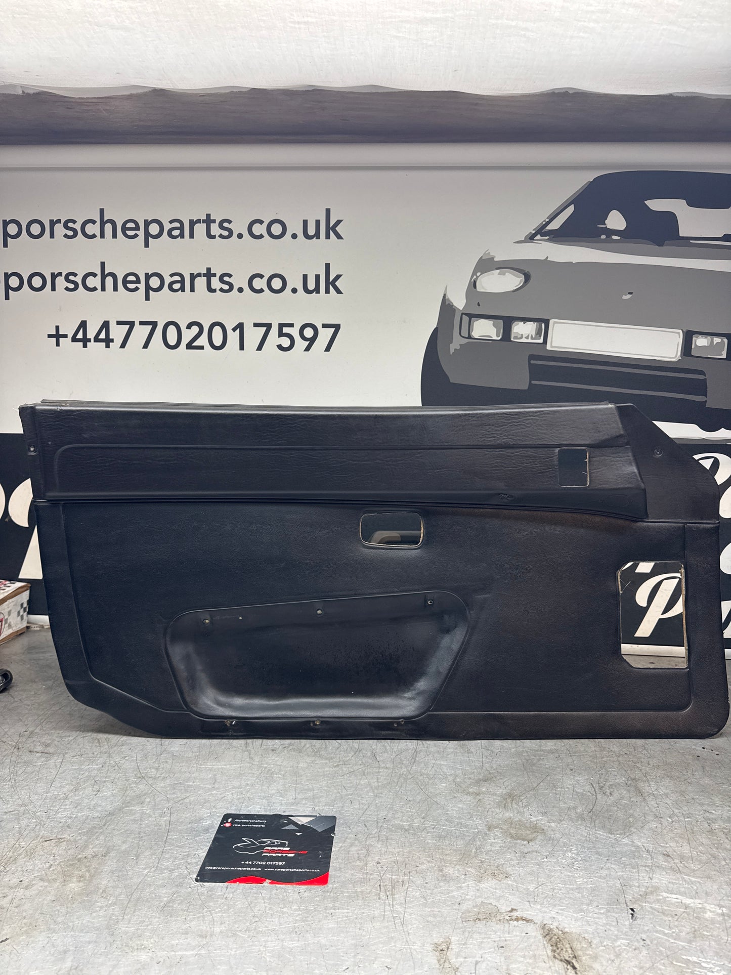 Porsche 924/ Early 944 black RHD Left door card. Fibreglass repaired. 477867012