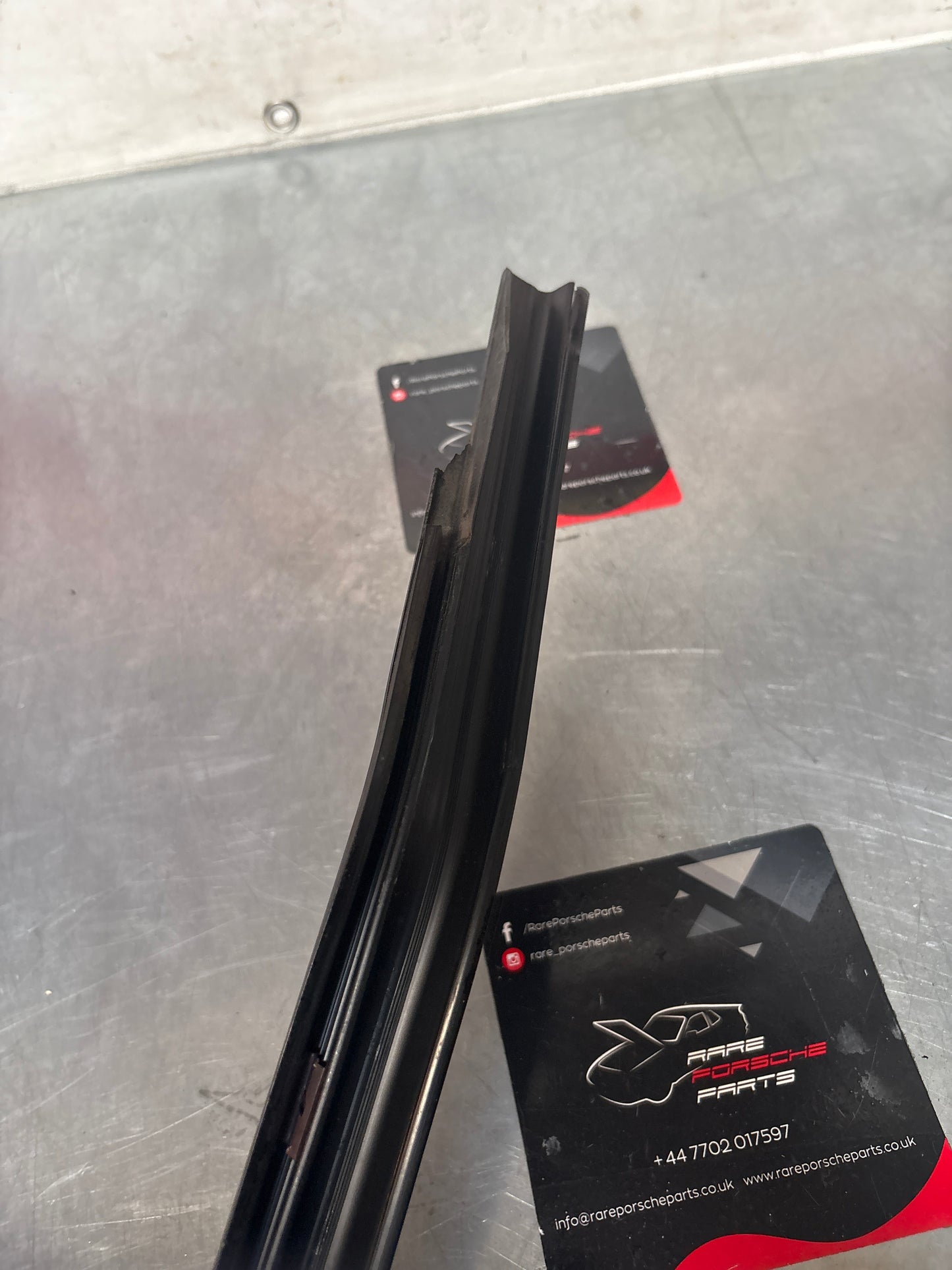 Porsche 944 85.5- left sill trim, scuff plate used 94455112100 cracked