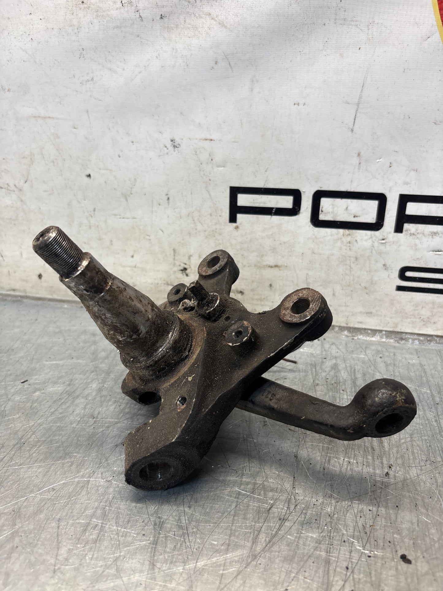 Porsche 928 left steering spindle knuckle, used 92834105717