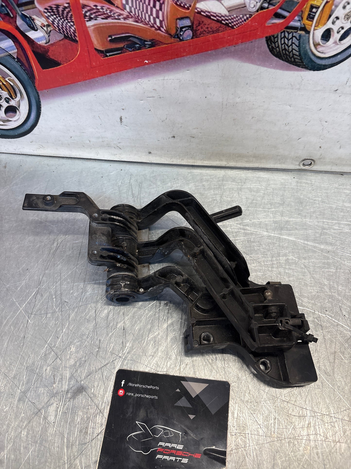 Porsche 968 right headlight swivel frame, used 94475057200 / 94475057400 / 94475037800