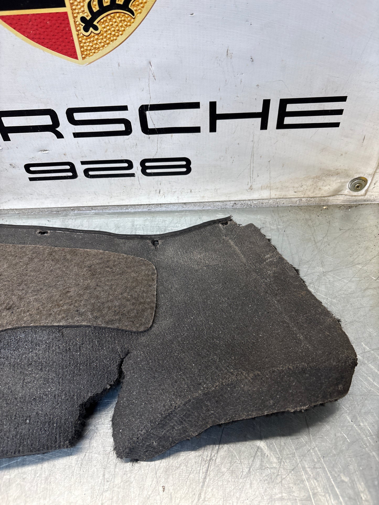 Porsche 924/944 85.5- rear left side trim carpet, black, 94455508301, used