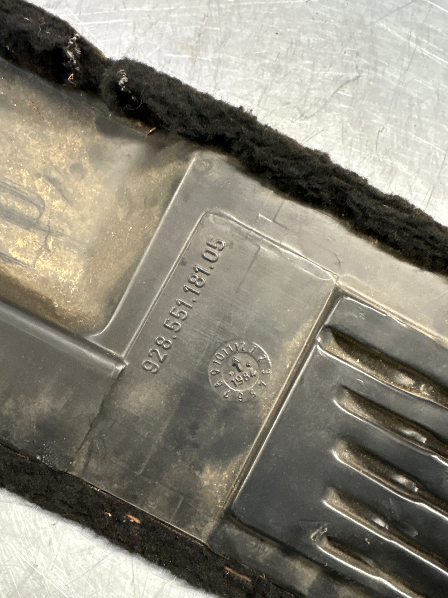 Porsche 928 black/grey-beige carpeted Tool kit panel cover, used 92855118105