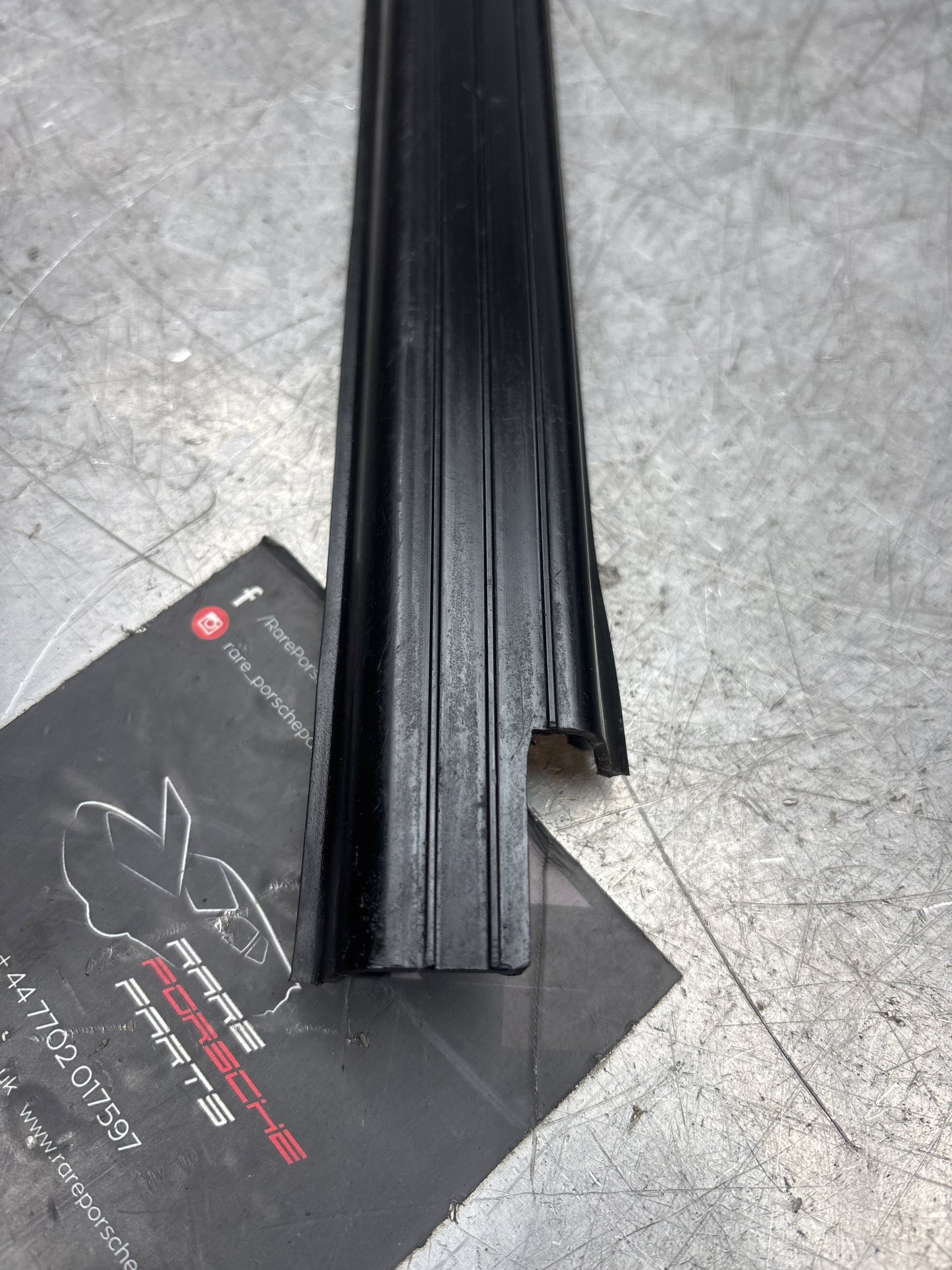 Porsche early 924/944 left sill trim, used 477853657A no cracks