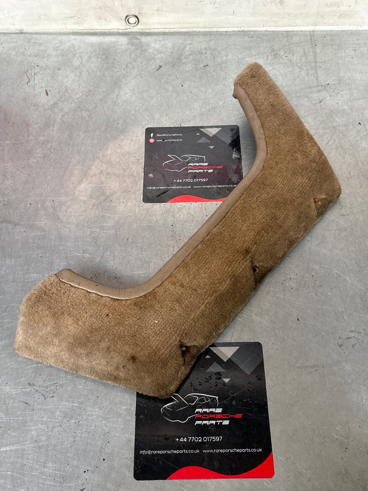Porsche 924/944 Left, Passenger side cream carpeted door pocket, used 477867133
