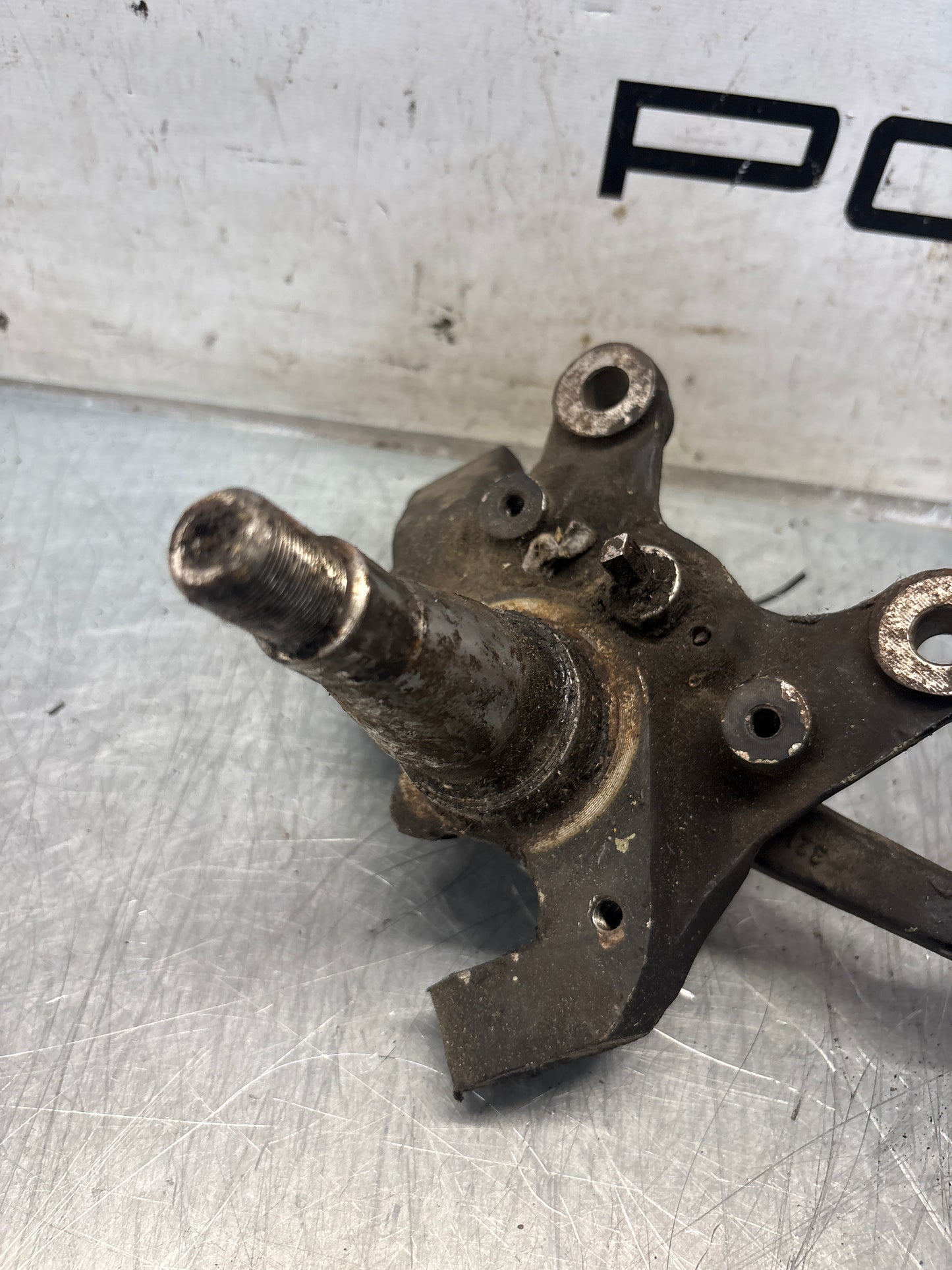 Porsche 928 left steering spindle knuckle, used 92834105717