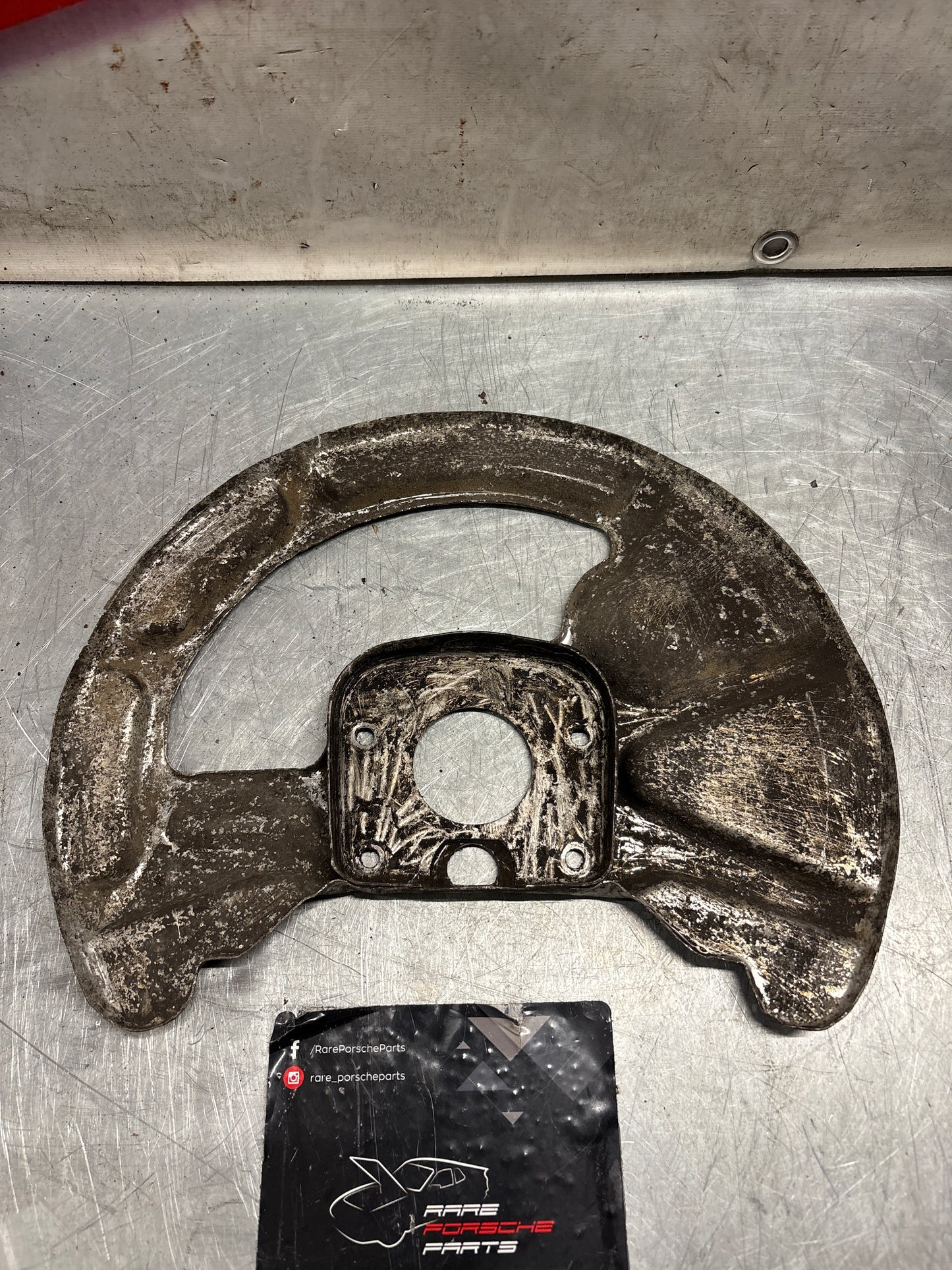 Porsche 928 front right brake disc cover,used 92835108400