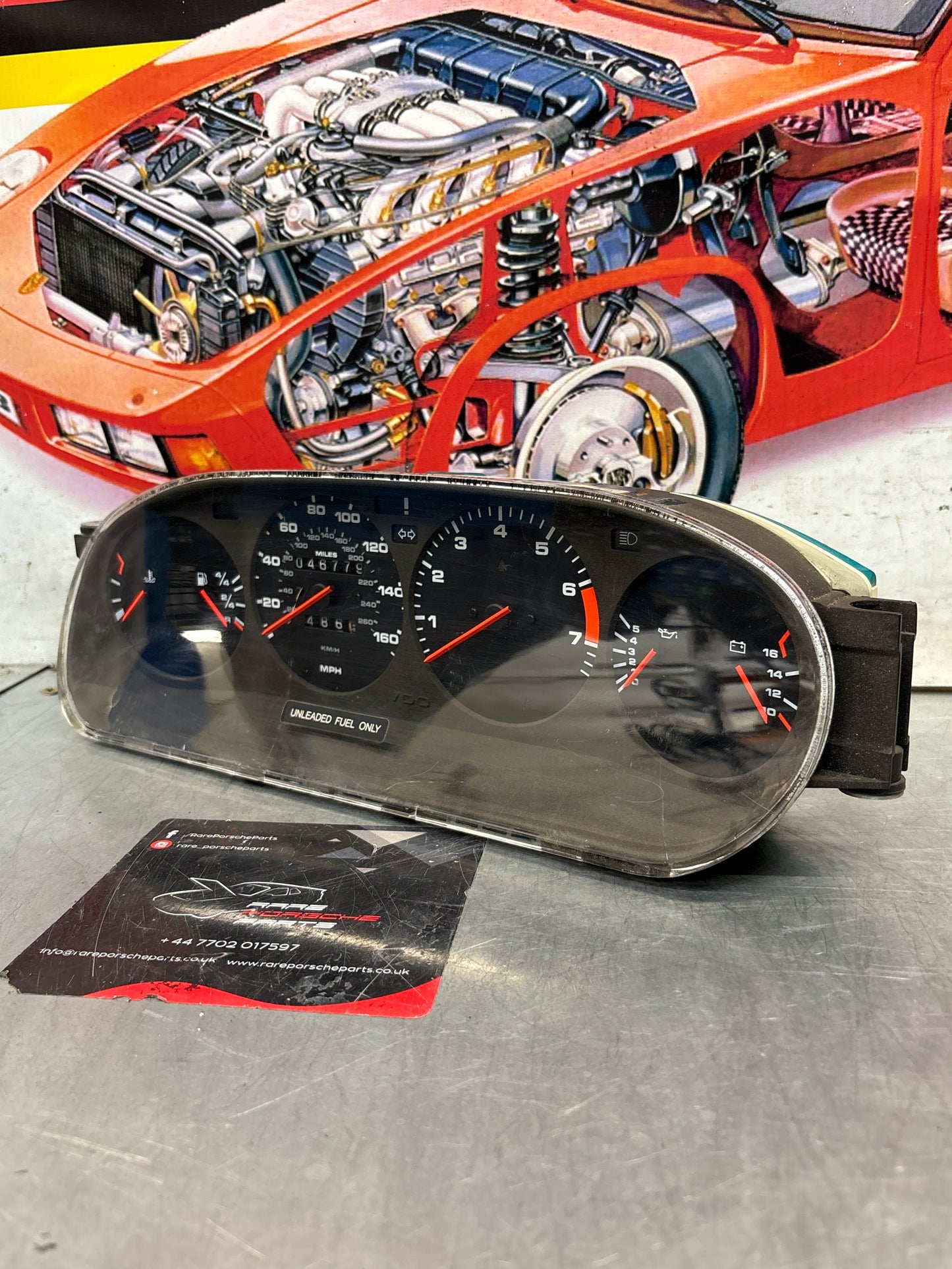 Porsche 928 dash clock binnacle pod speedometer, 92864110235 used  showing 046779 Km, plastic screen has some scratches