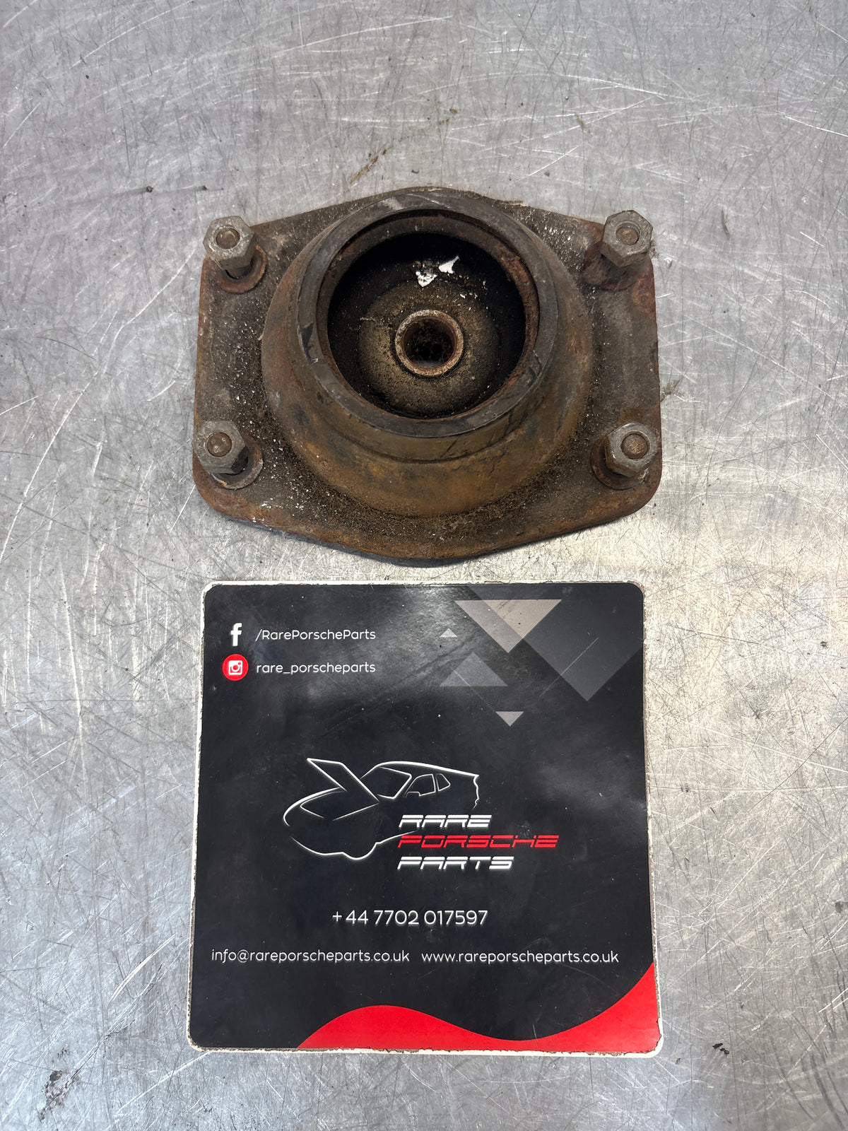 Porsche 924 / 944 front suspension bearing flange, 477412345, used