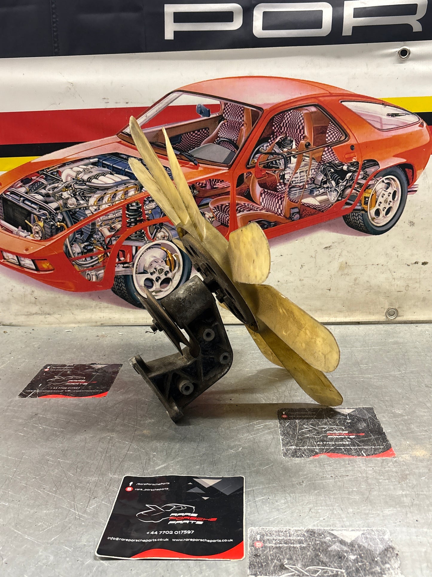 Porsche 928 late engine cooling fan clutch with bracket, used 92810611205 / 92810613701 / 9281061104R