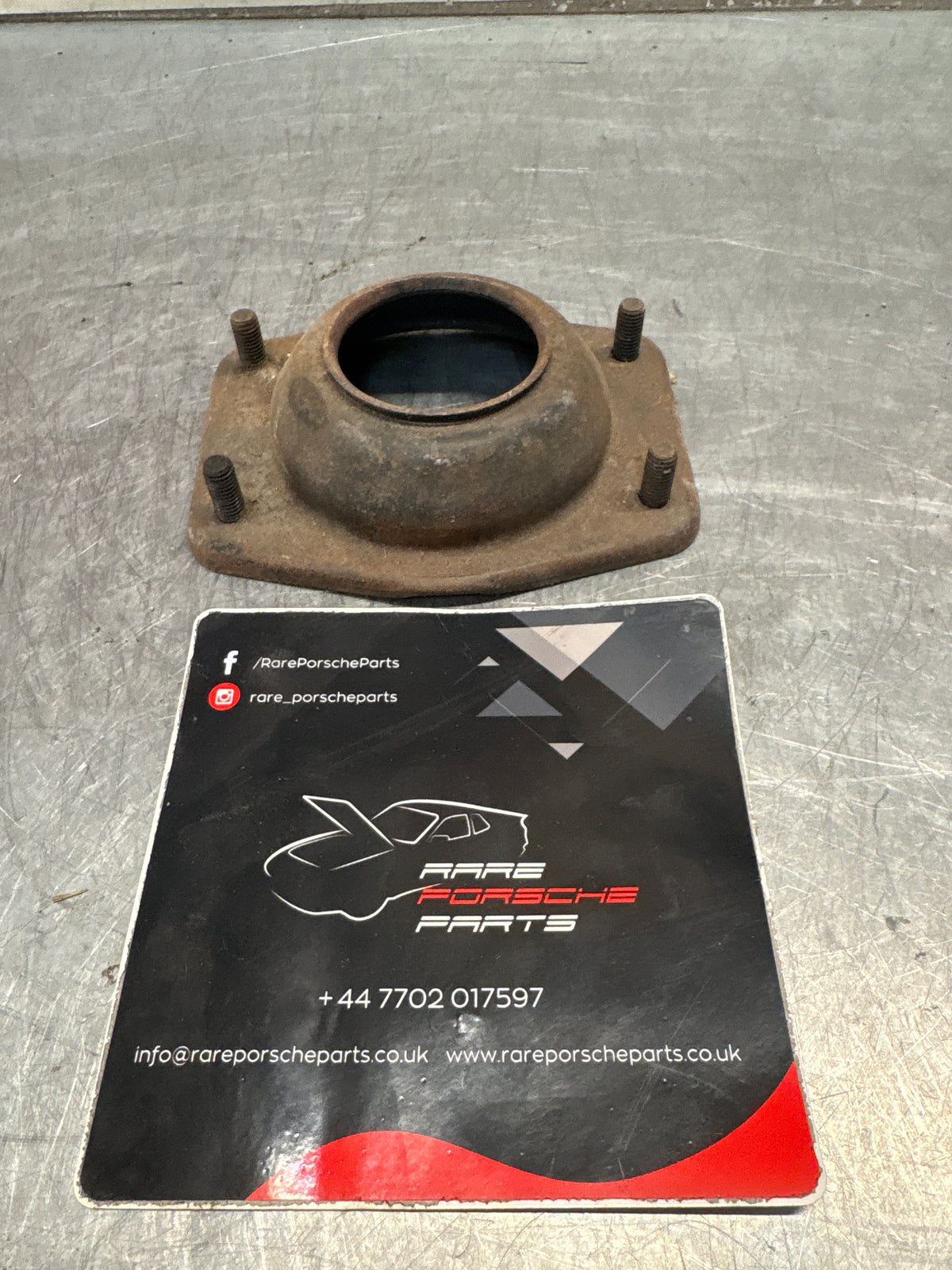 Porsche 924 / 944 front suspension bearing flange, 477412345, used