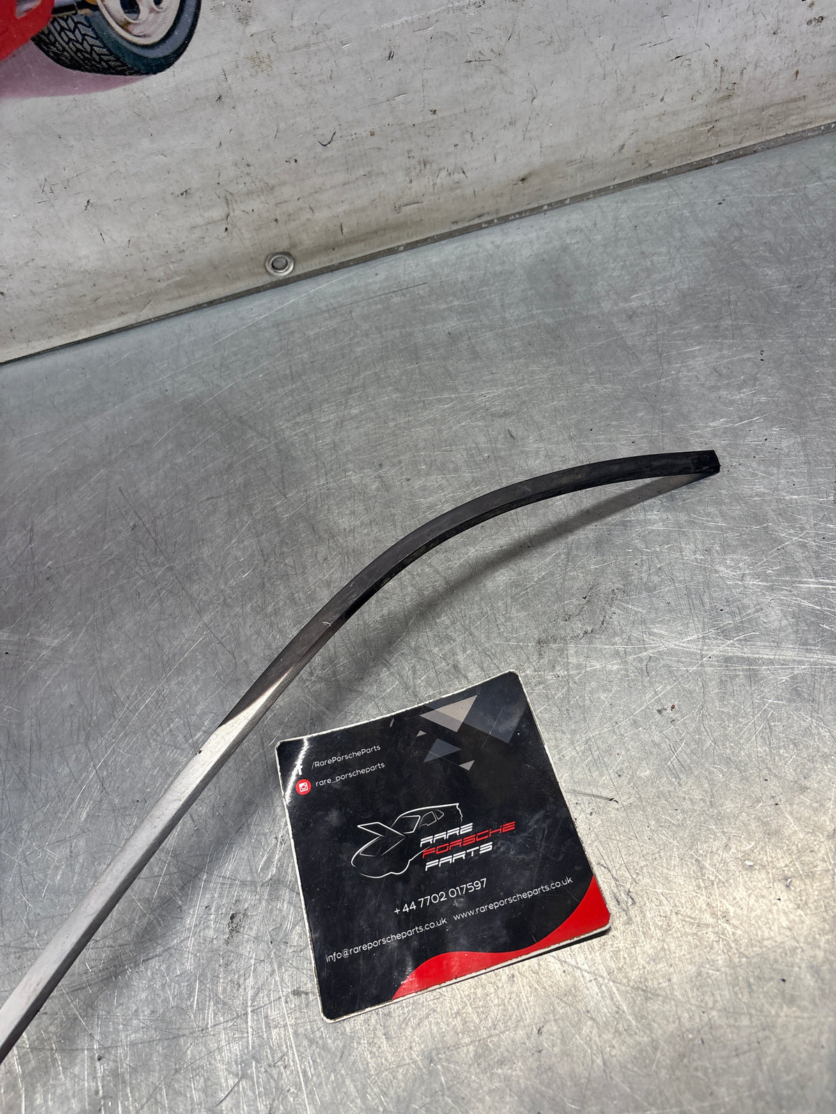 Porsche 928 rear left quarter glass cover strip, used 92854341708