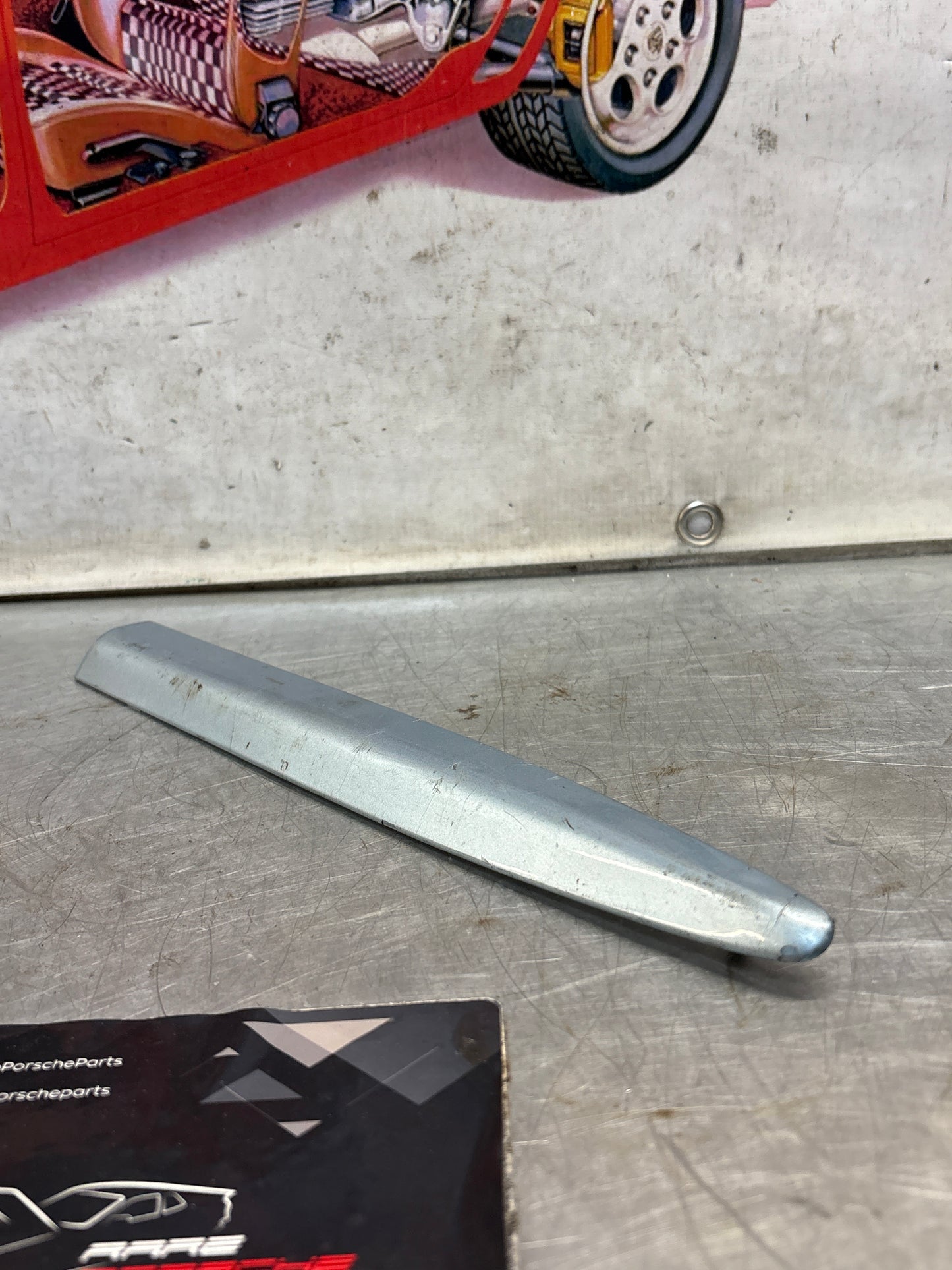 Porsche 928 left side front wing molding trim, used 92855903703