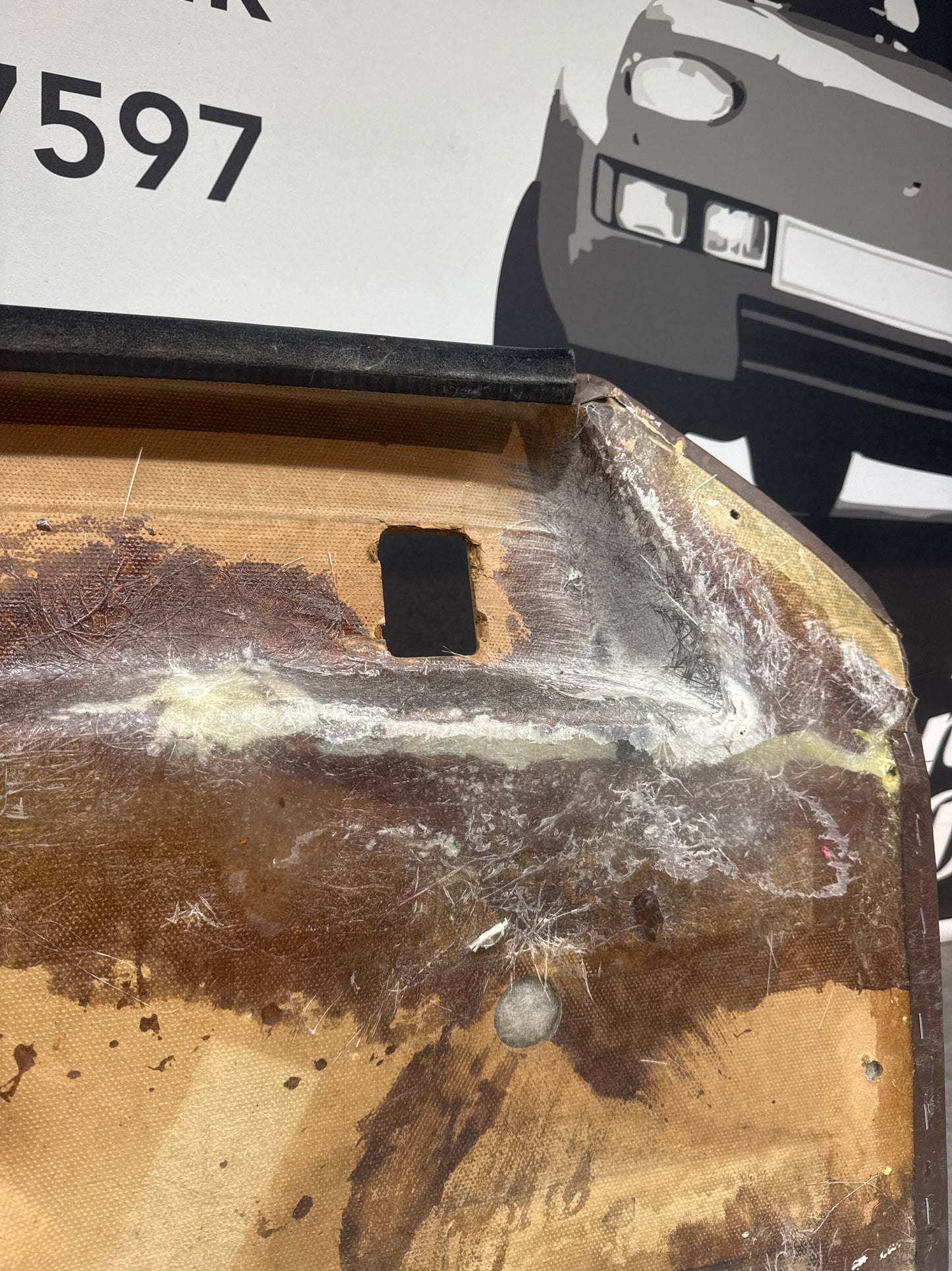 Porsche 924 / Early 944 Brown Script Door card. Left Hand Drive. Used. 478867011. Fibreglass repaired.