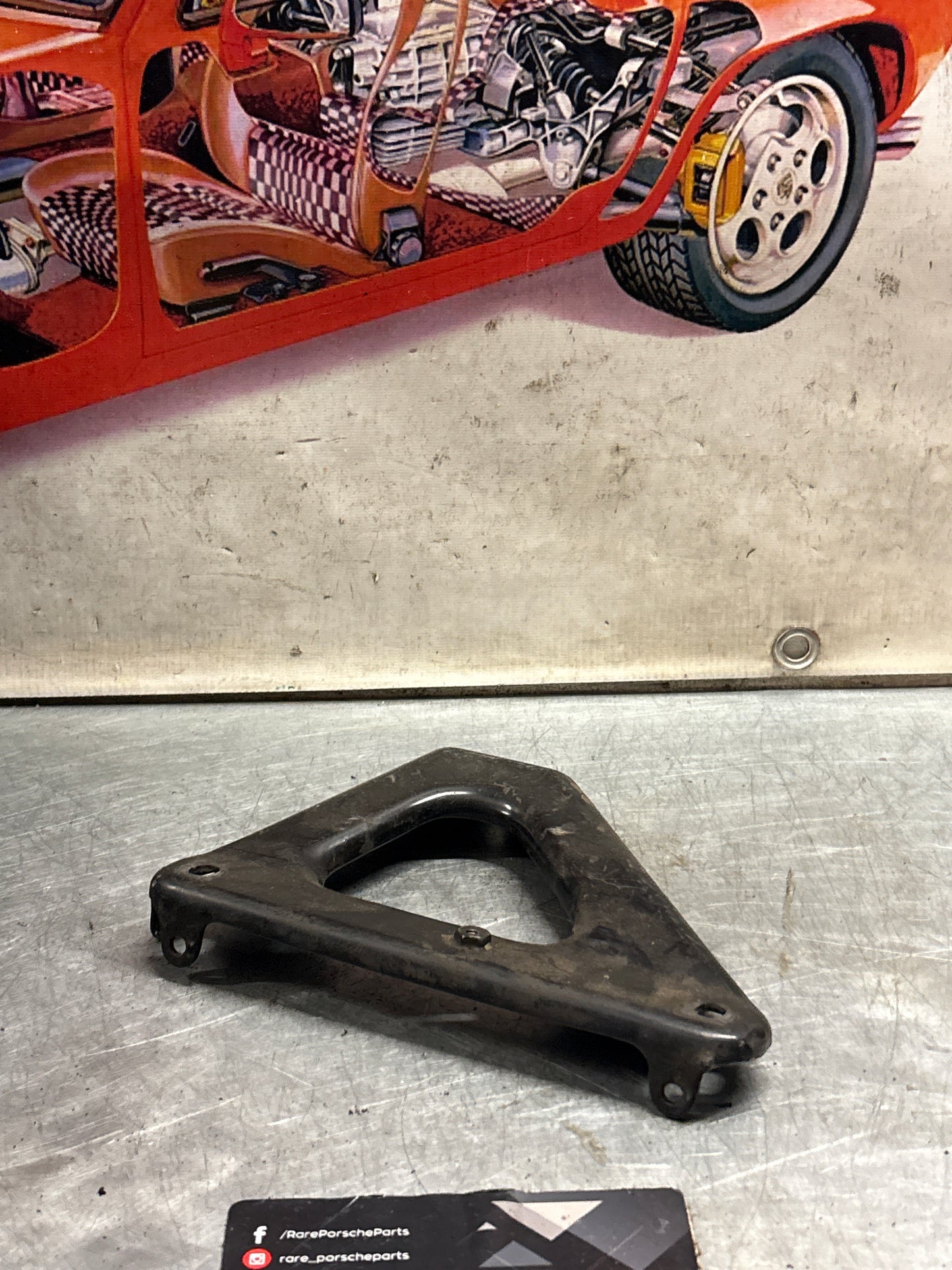Porsche 924 exhaust manifold support bracket, used 93111014501