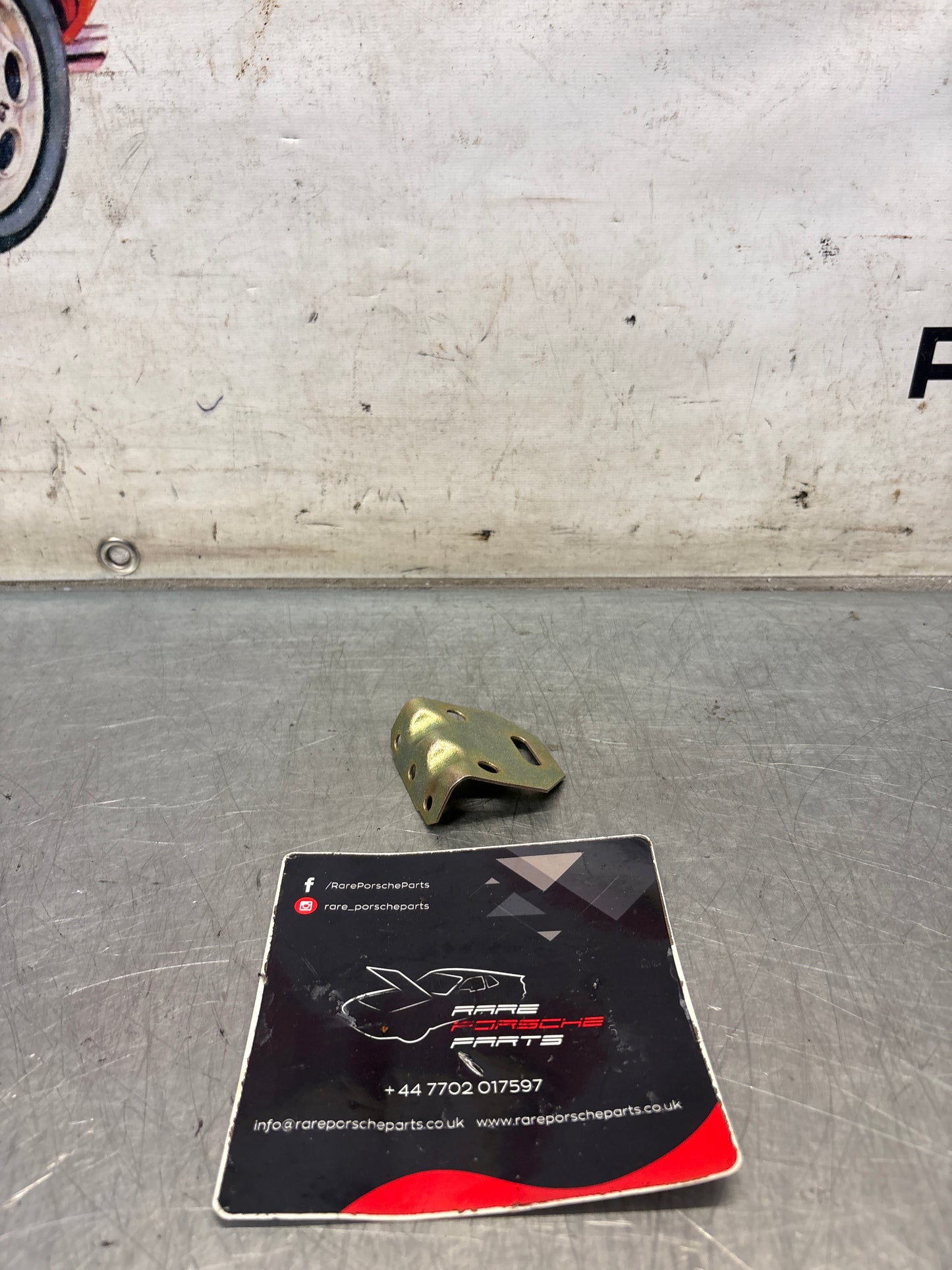 Porsche 944 fog light bracket, refurbished 94450137500