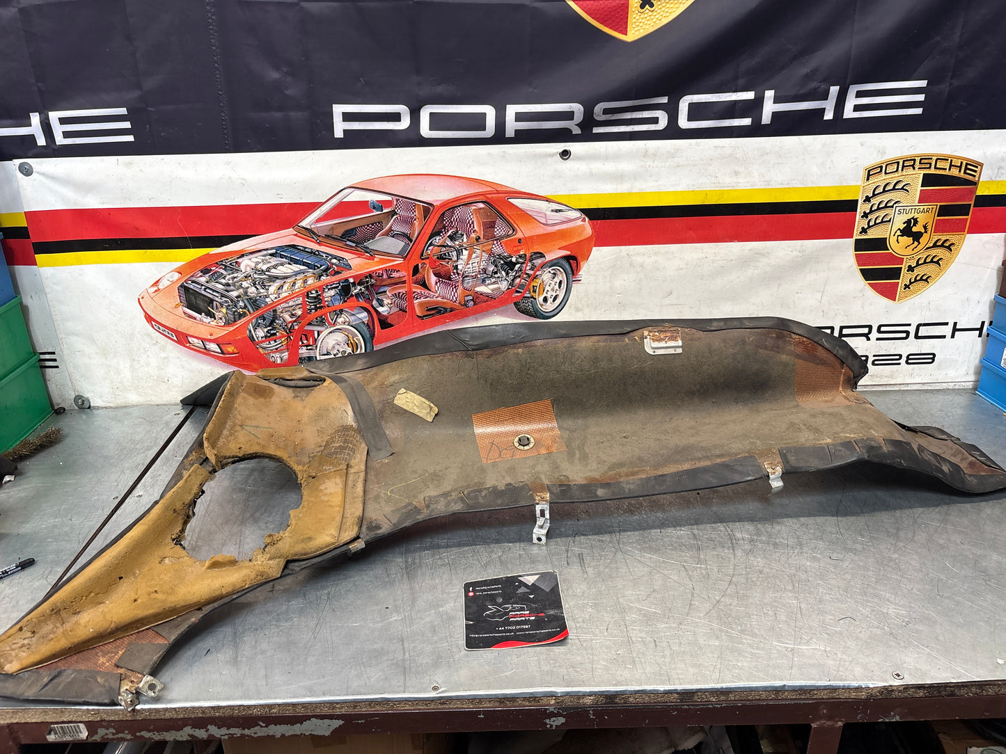 Porsche 928 early left side lower side trim panel, without loudspeaker, black used 92855502102