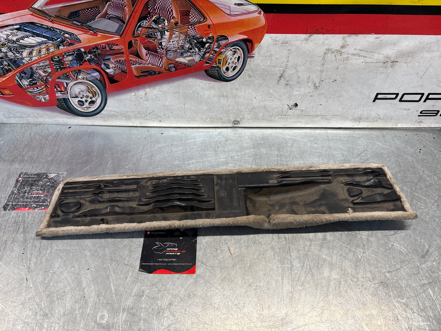 Porsche 928 white cream carpeted Tool kit panel cover, used 92855118106